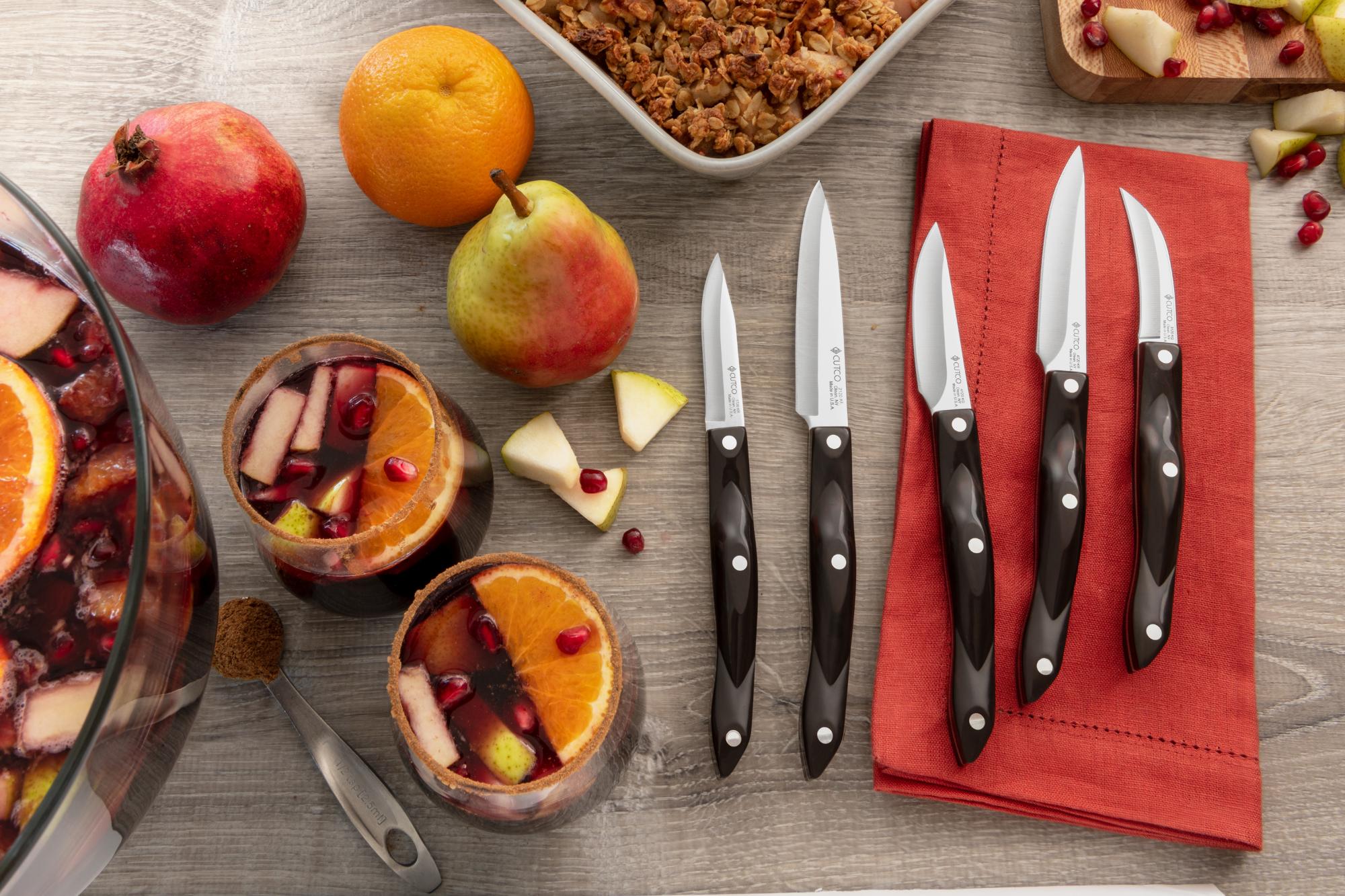 Paring knives with fruit.