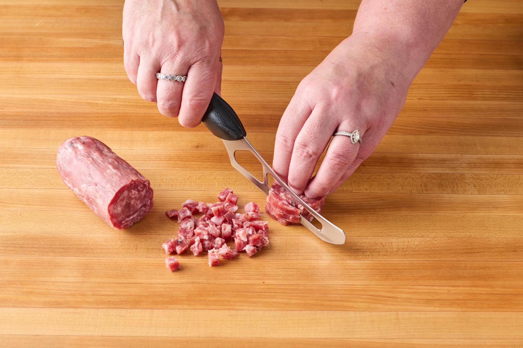 Chopping soppressata with Cheese Knife