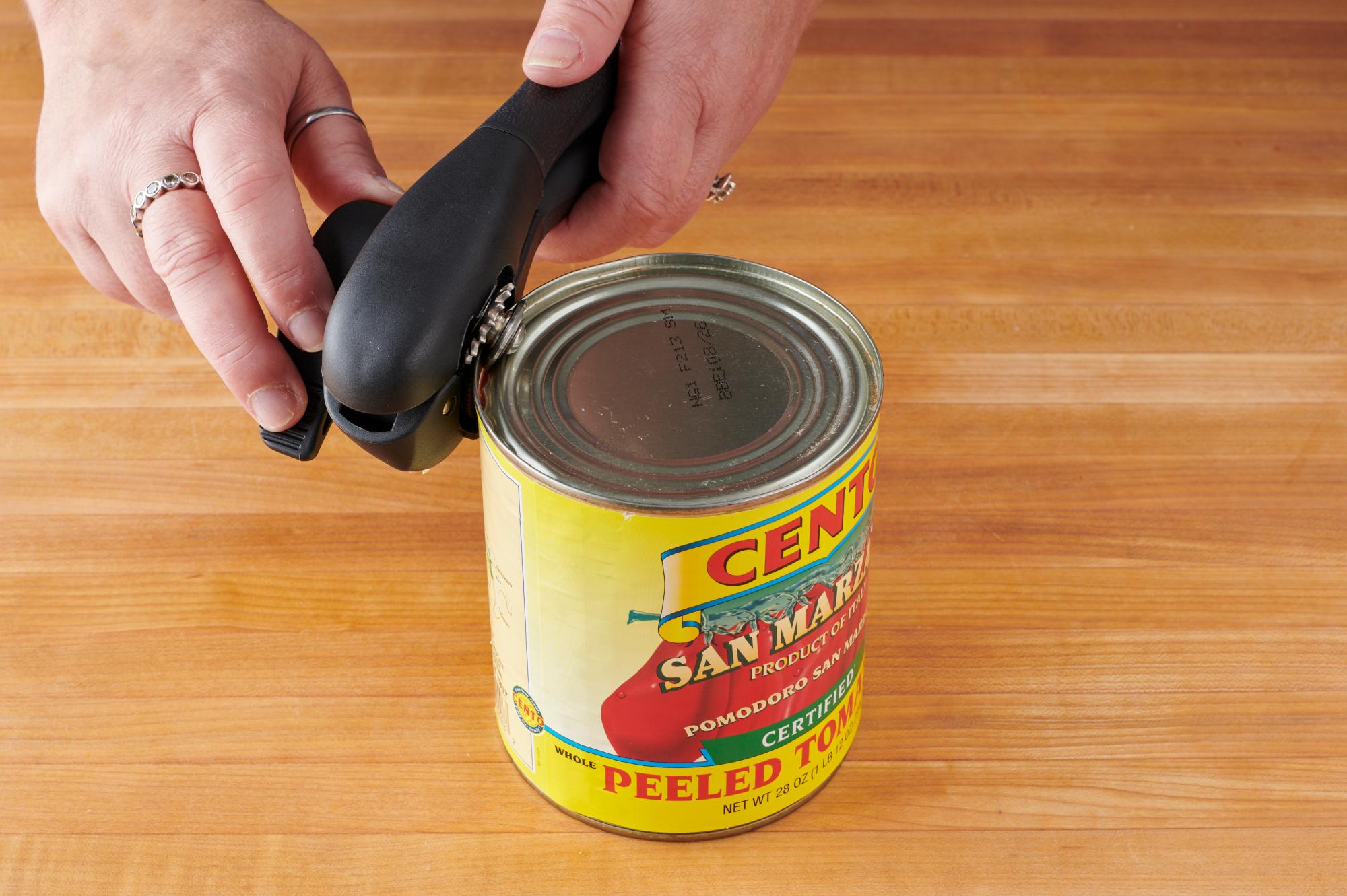 Opening a can with a Can Opener.