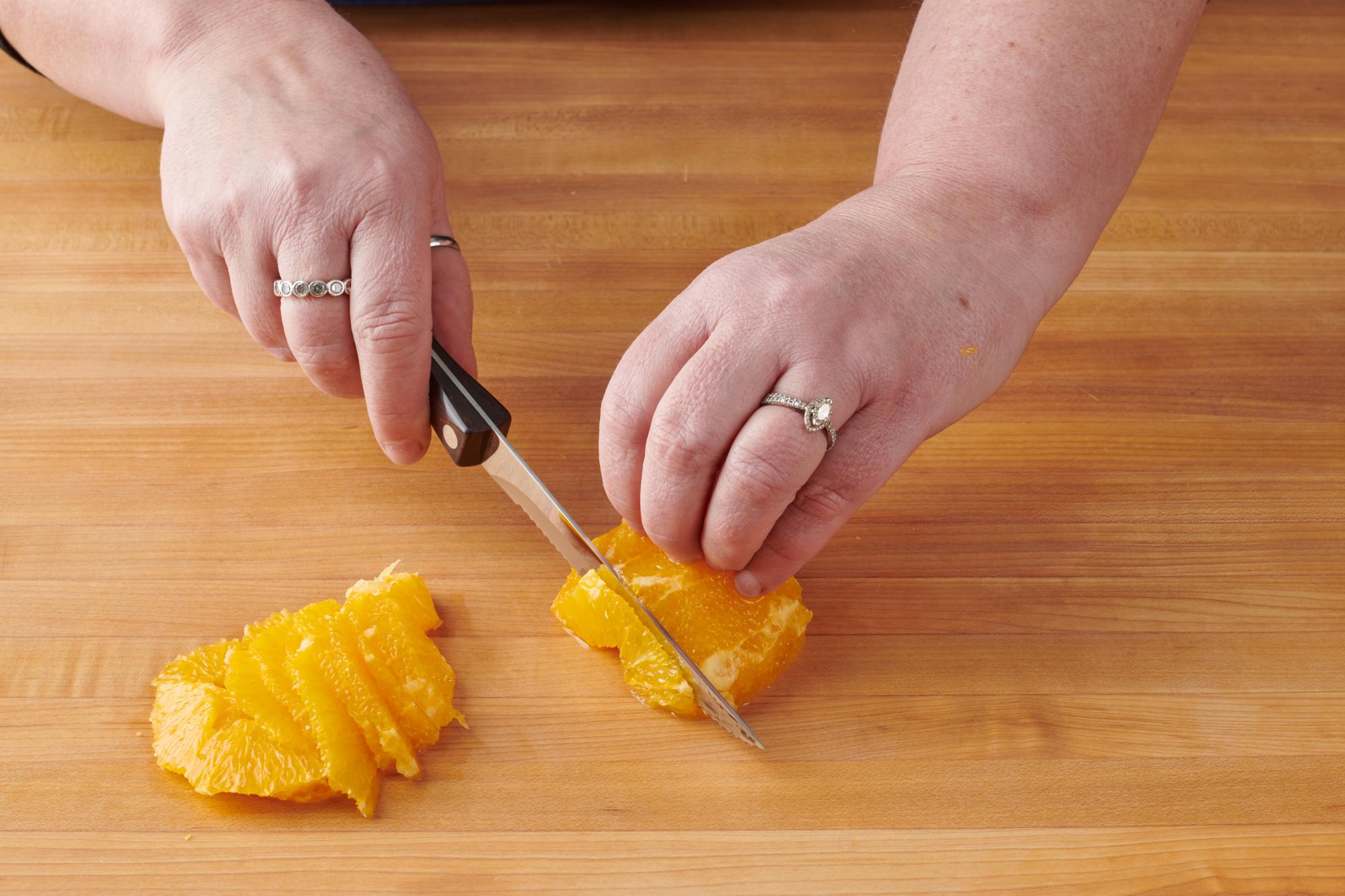 Slicing orange with a Trimmer.