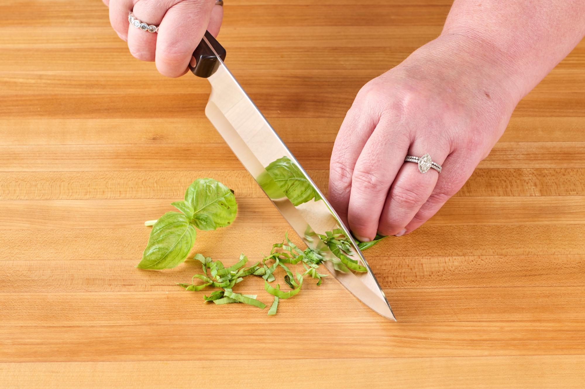 Chiffonade the basil using a 7-5/8″ Petite Chef