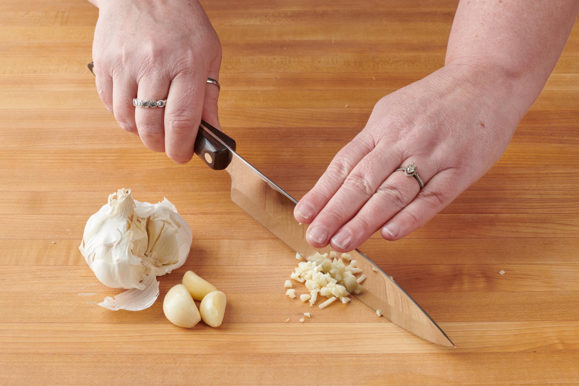 Mincing garlic with a Petite Chef.