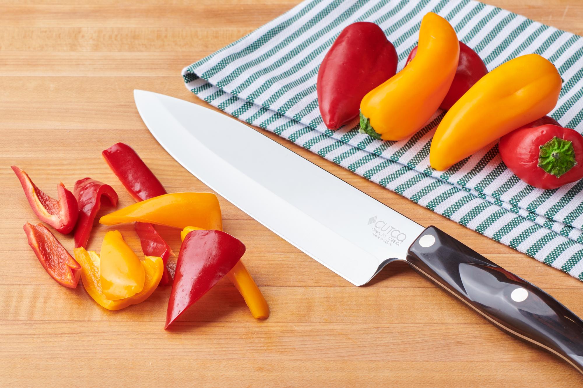 Halved on angle red, yellow and orange peppers with P Chef