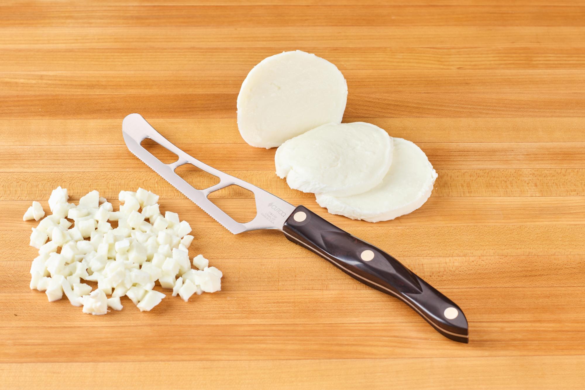 Using the Traditional Cheese Knife, dice the cheese