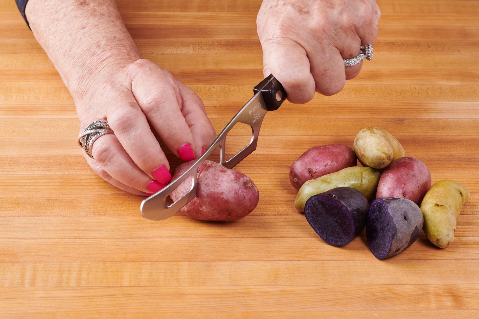 Pieces of potato with Traditional Cheese knife