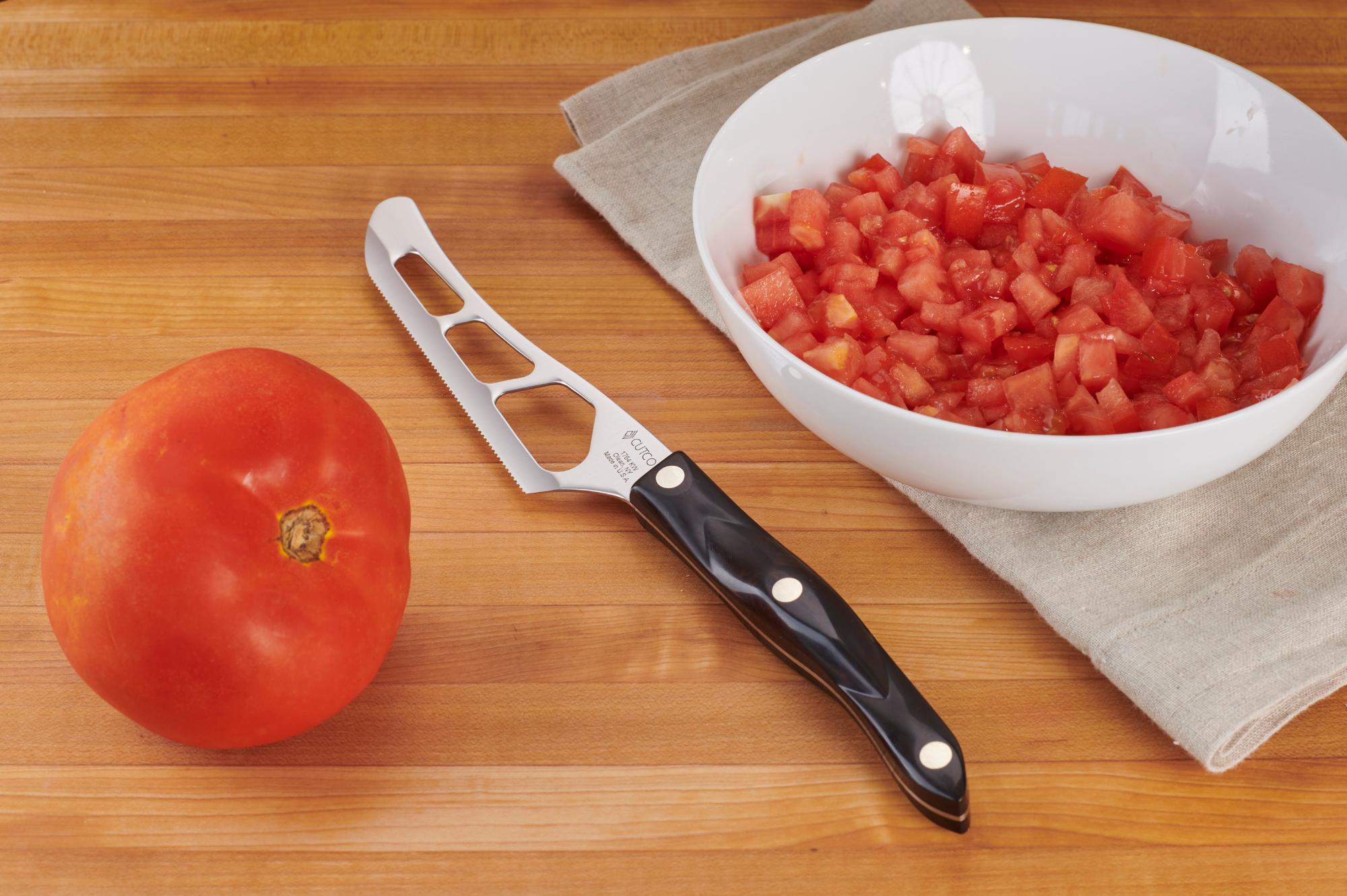 Cut tomato with a Traditional Cheese Knife.