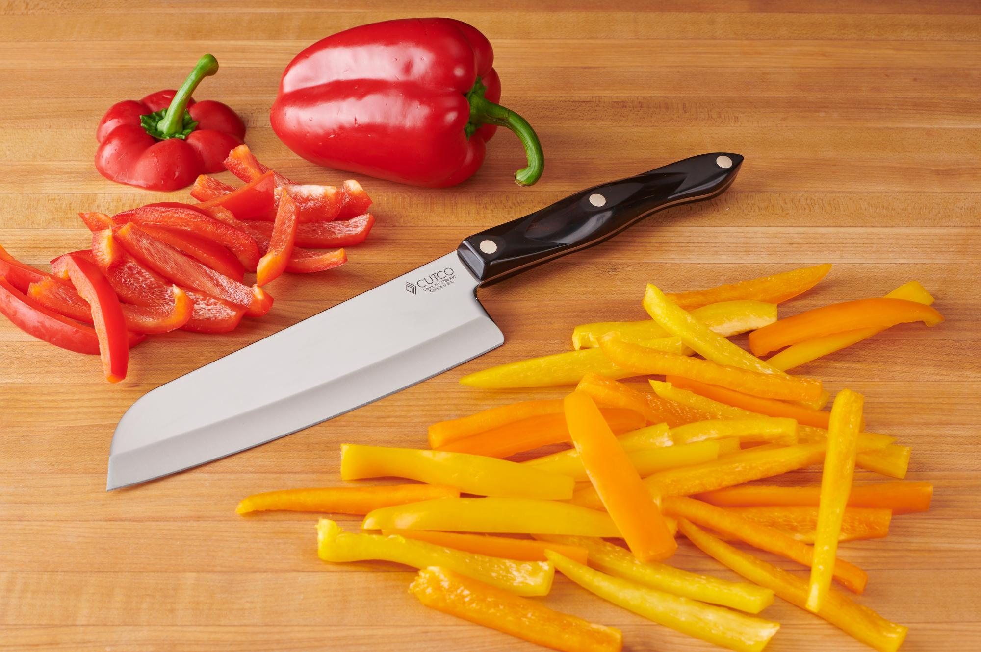 Slicing the peppers with a Santoku.