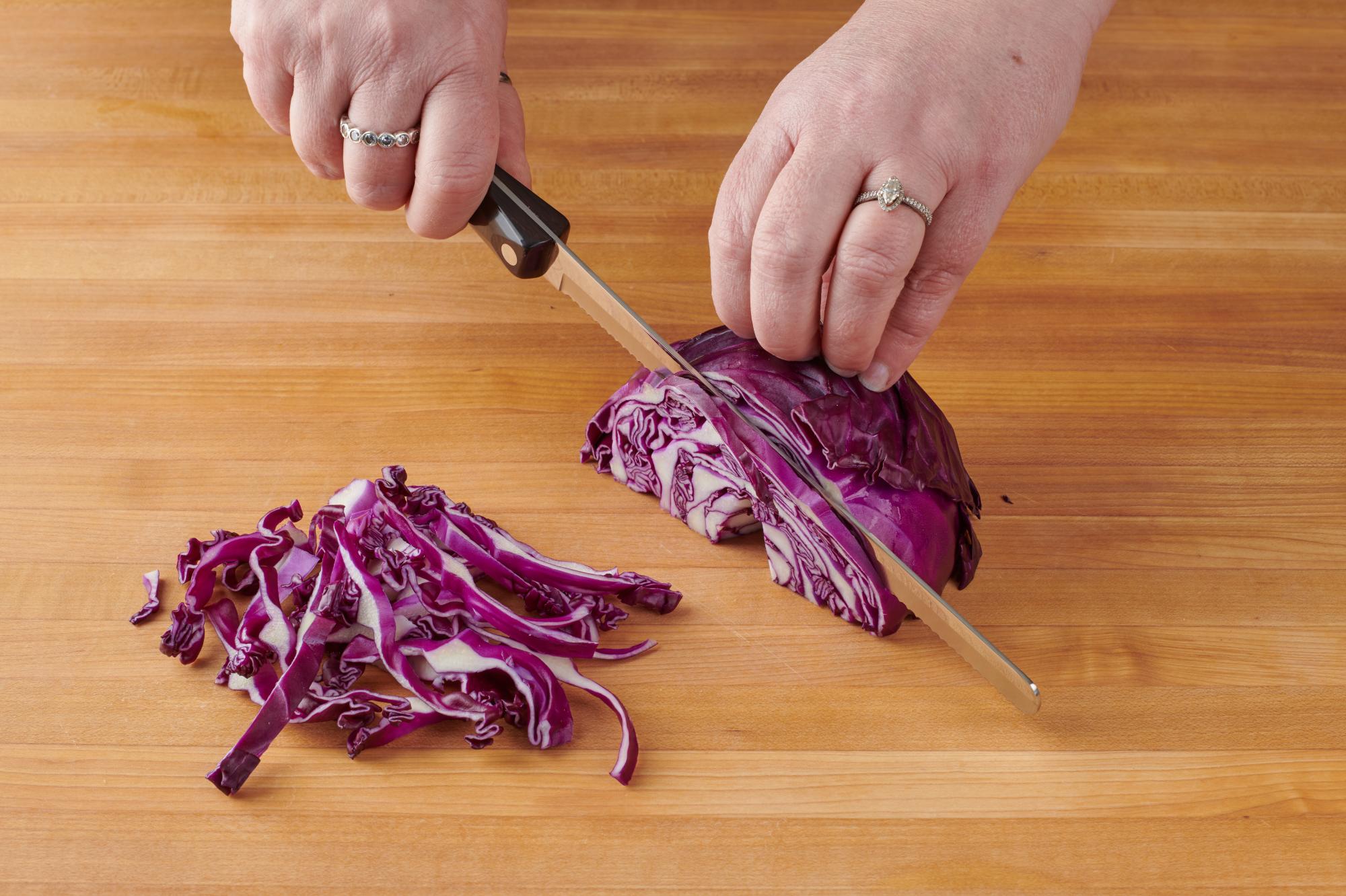 Shredding the red cabbage with a petite slicer.