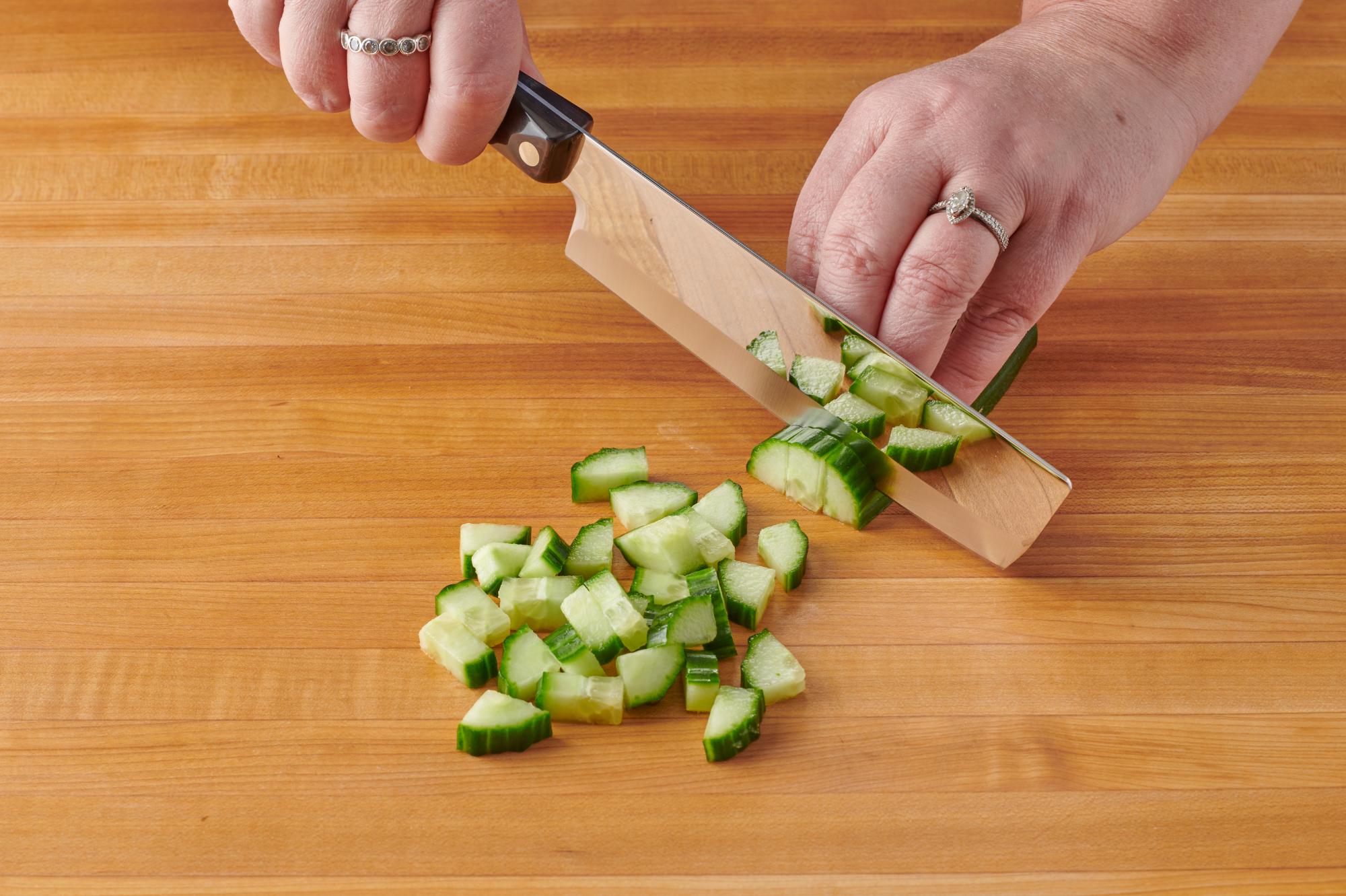 Cutting the cucumber with a 6 Inch Vegetable Knife.