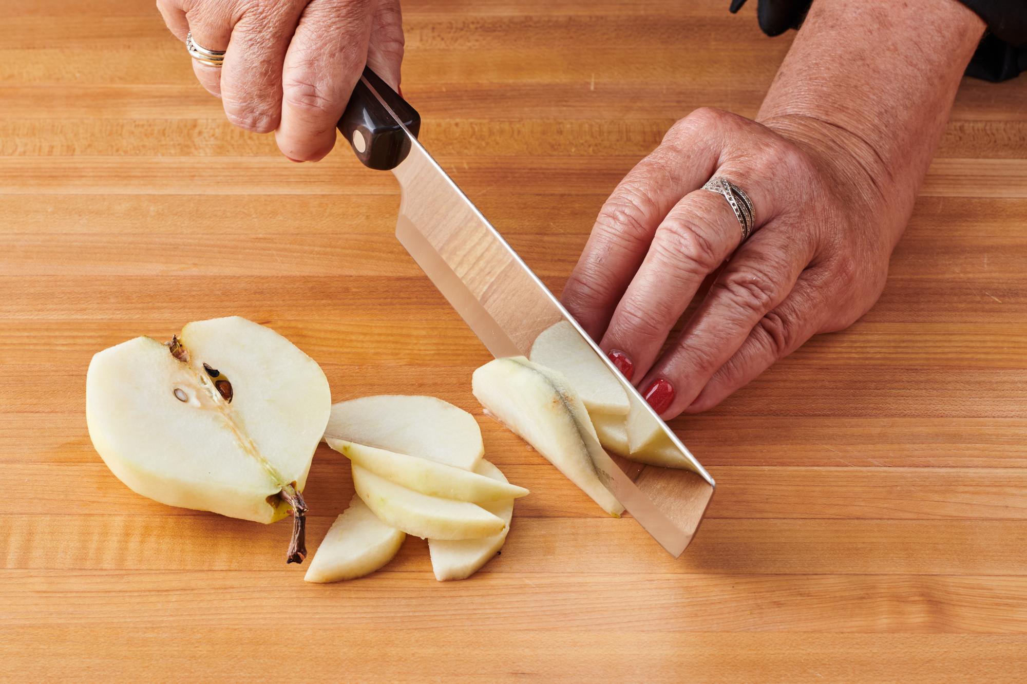 6″ Vegetable Knife cutting pear