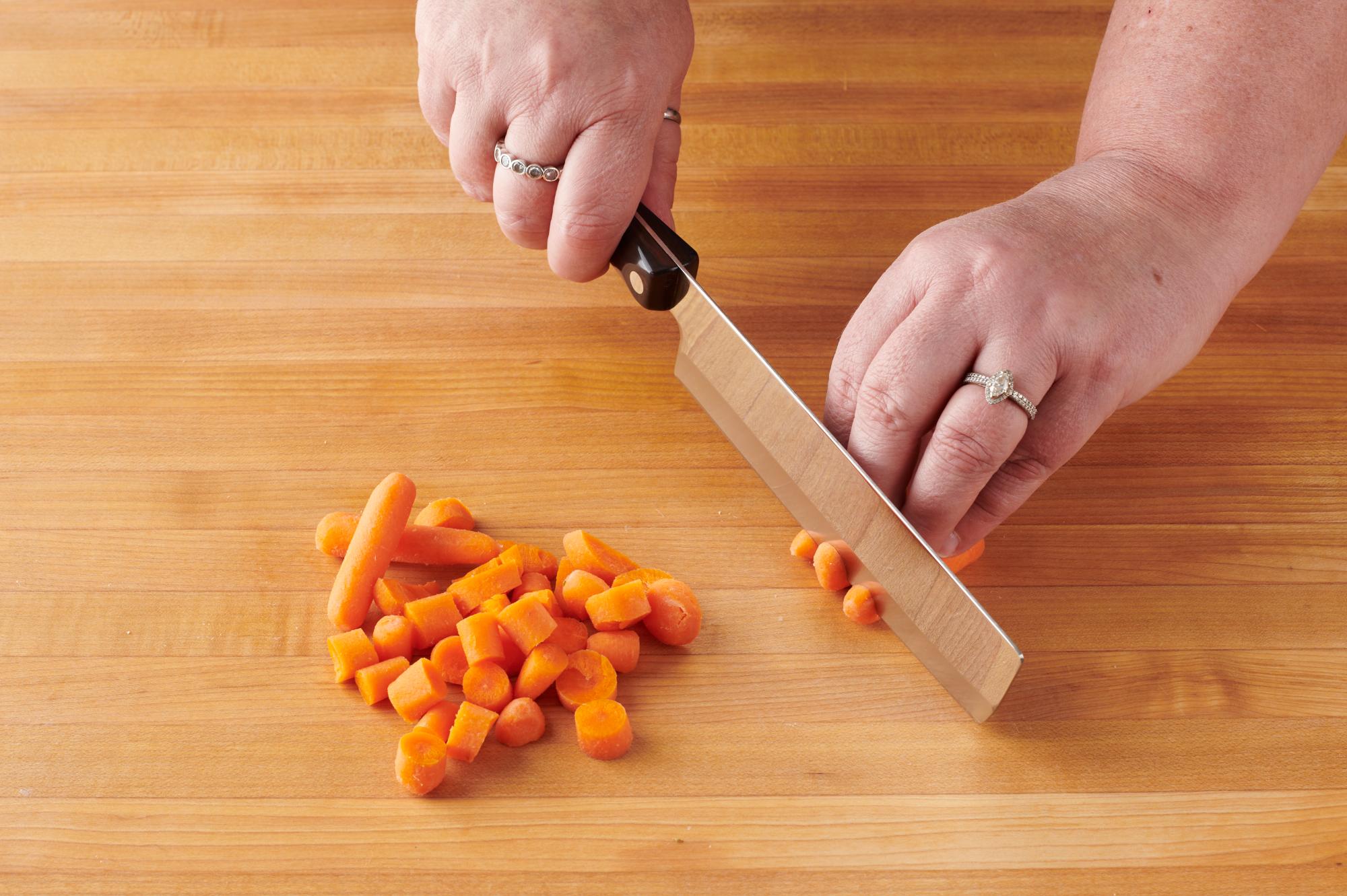 Cut the baby carrots into bite-sized pieces with a 6 inch Vegetable knife.