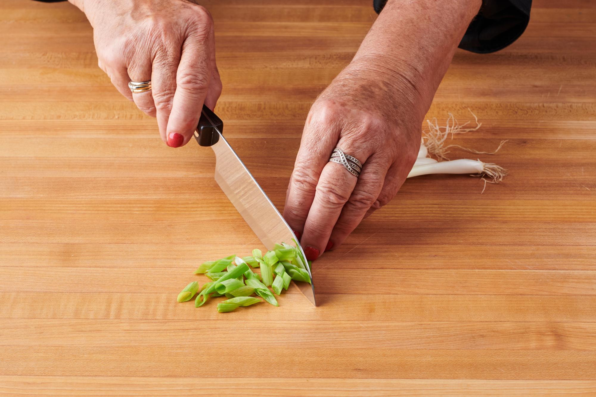 Slicing green onion on long bias with 4” Vegetable Knife