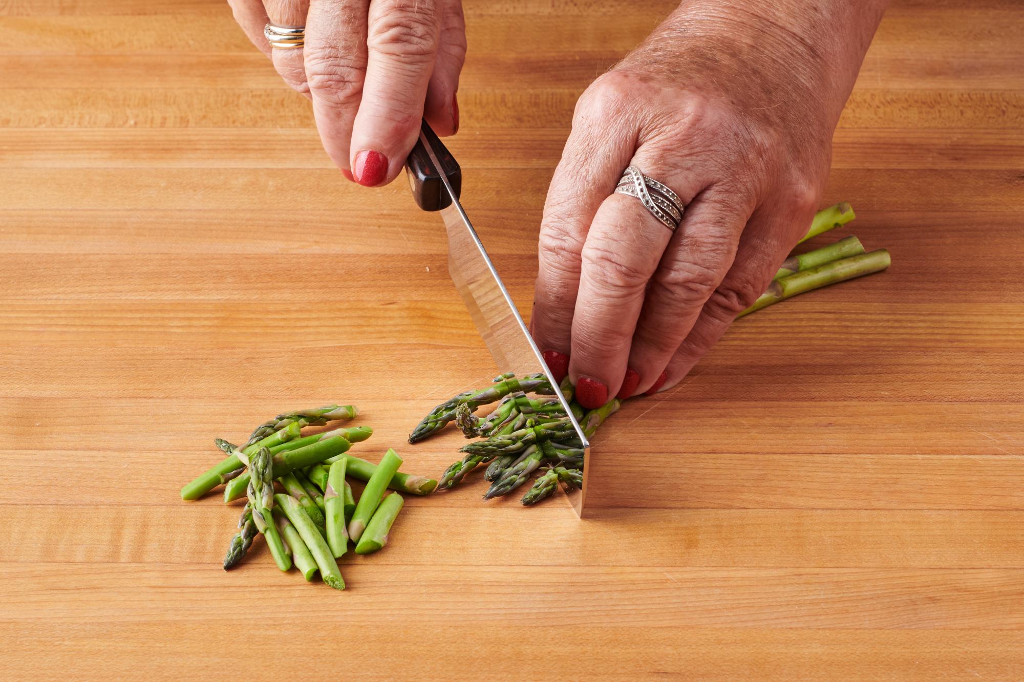 Cutting asparagus on bias with 4” Vegetable Knife