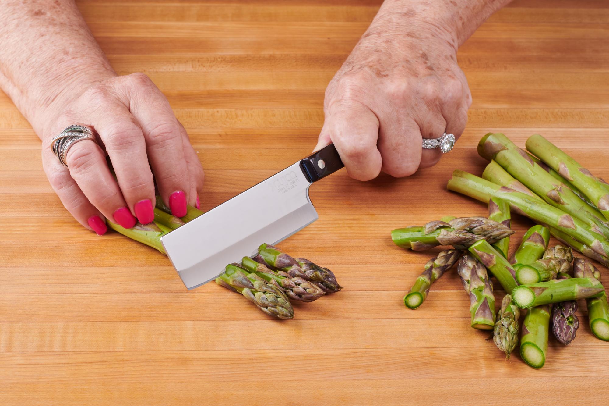 Cutting asparagus with 4″ Vegetable Knife