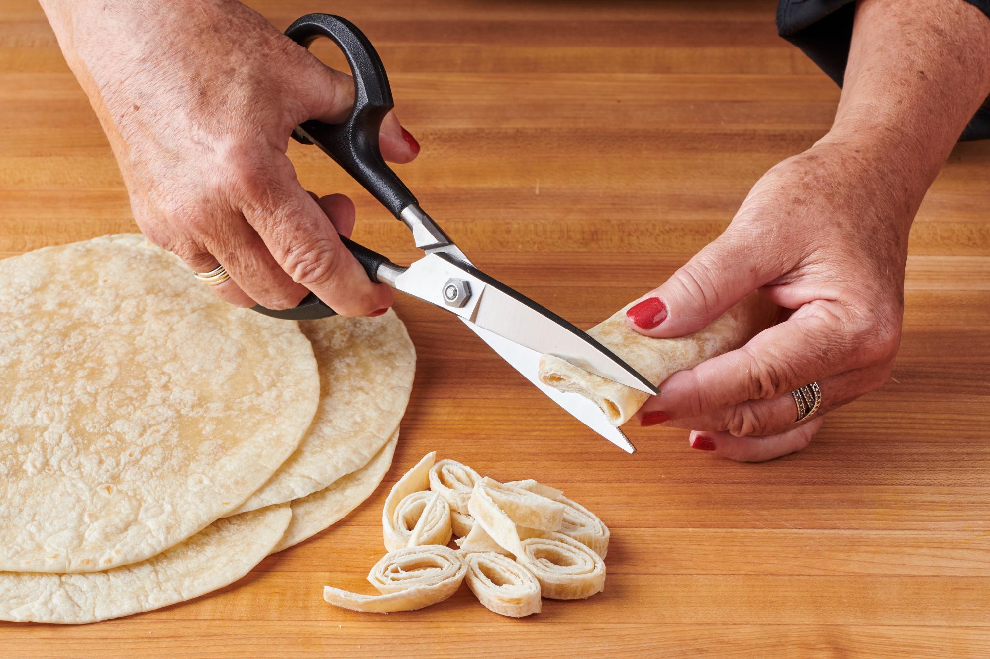 cutting tortilla with shears