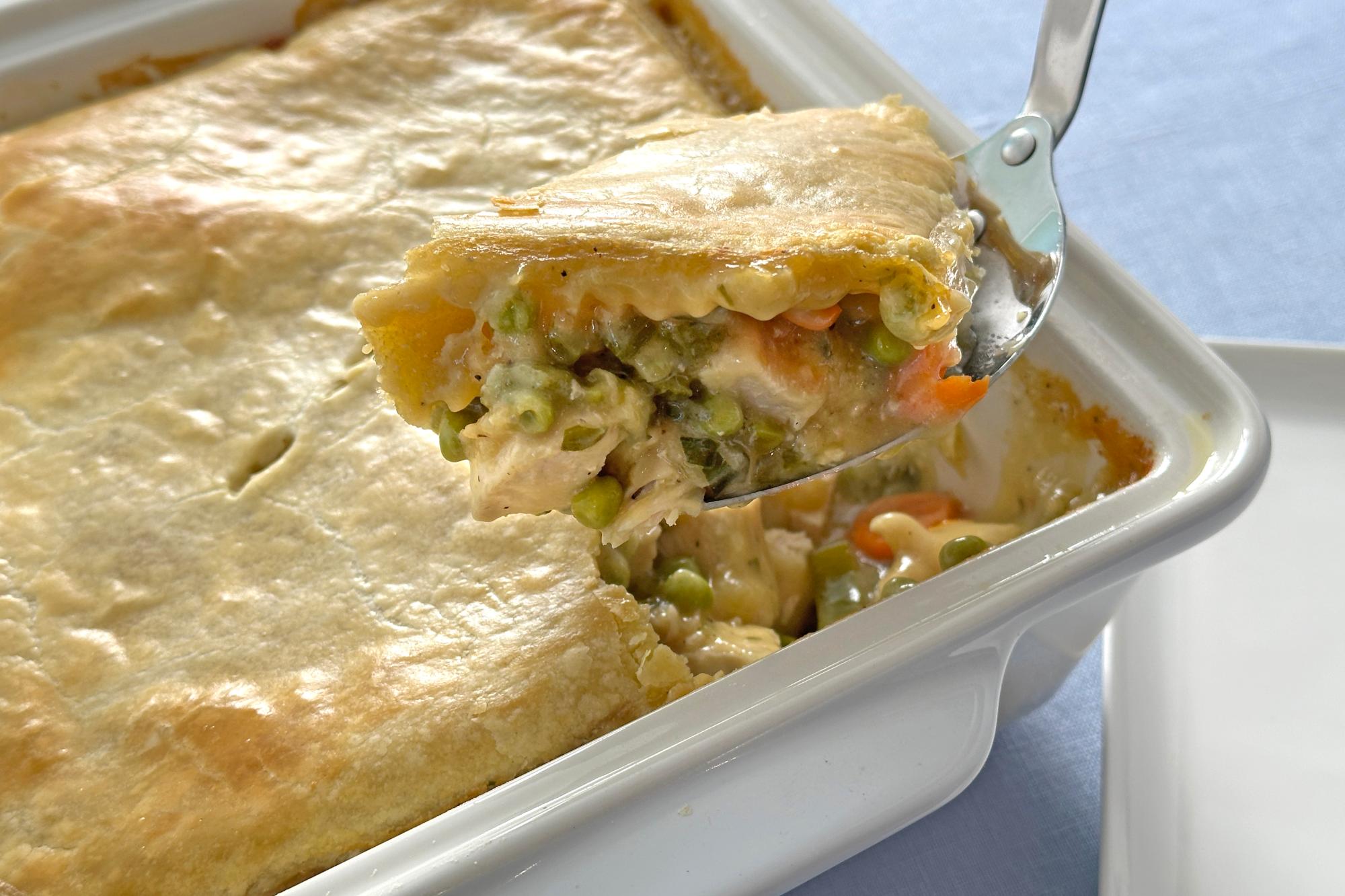 Scooping out chicken pot pie