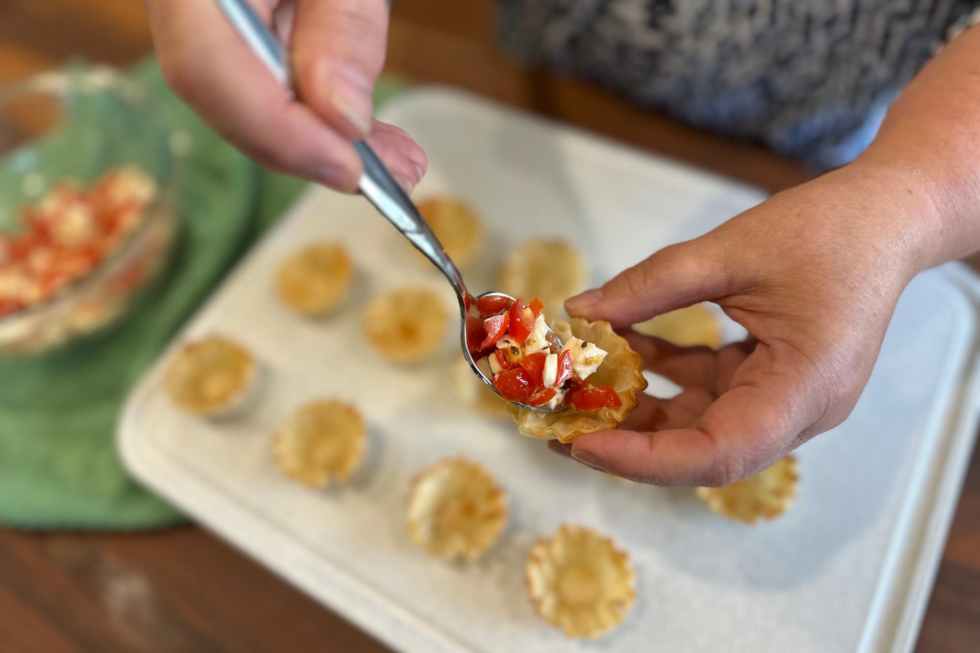 Fill each cup with an equal amount of the tomato mixture.