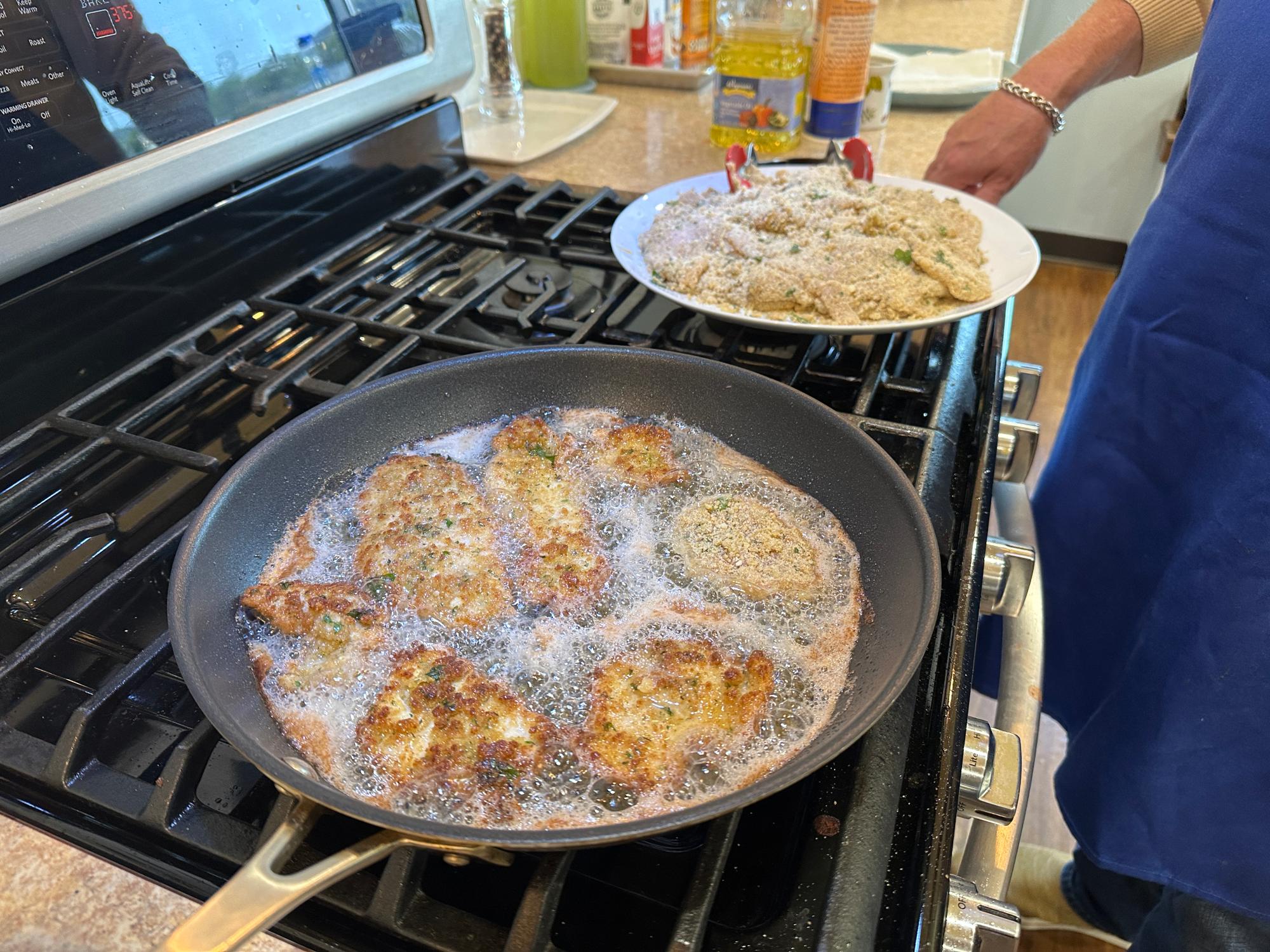 Frying the cutlets in a pan.