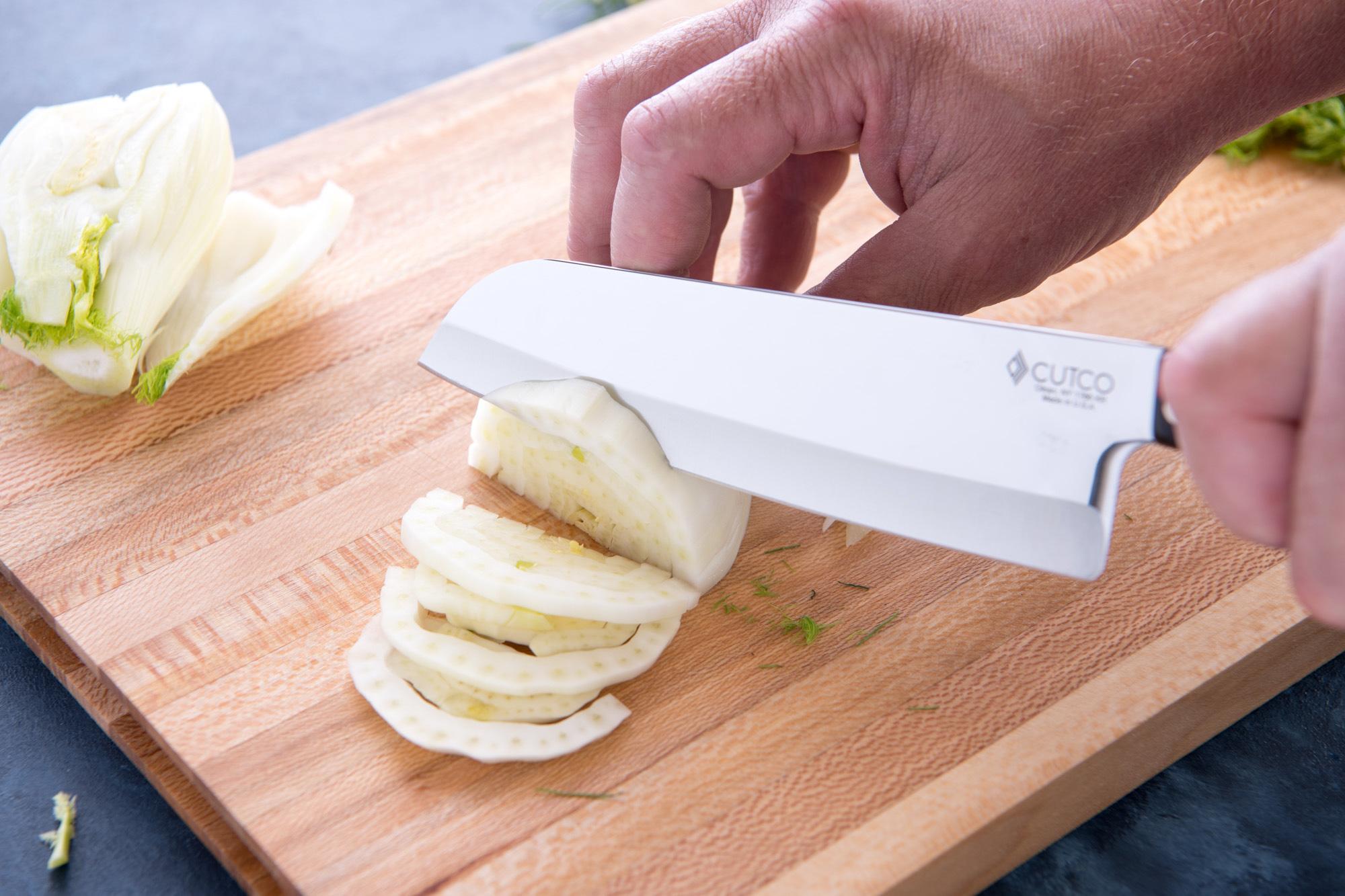 Using the Santoku to slice fennel and red onion.