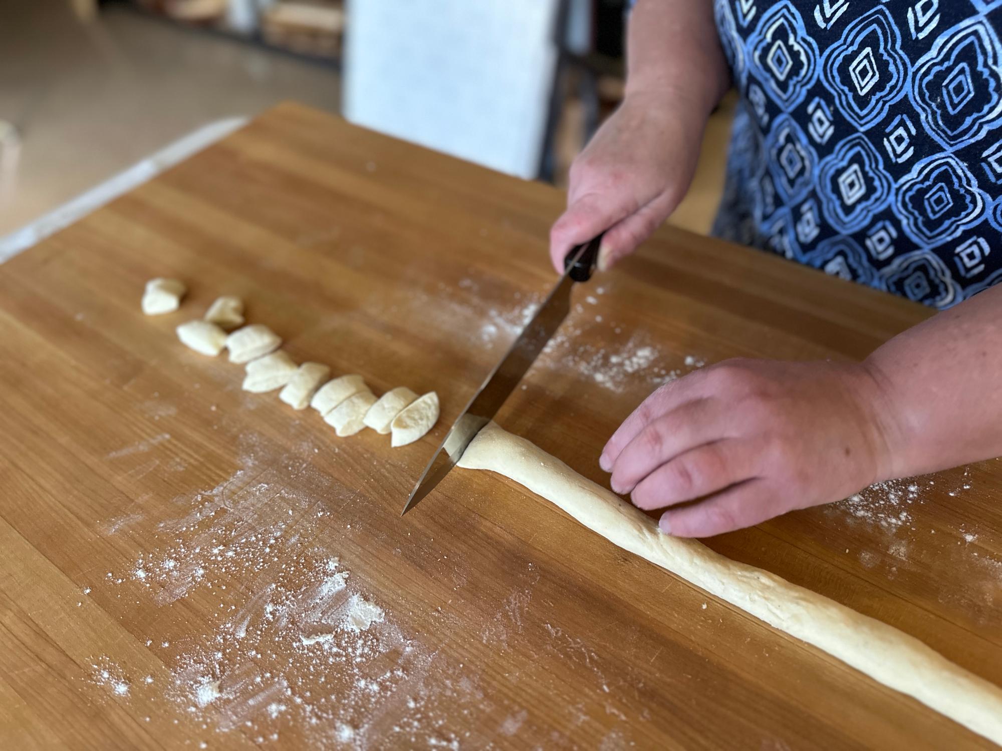 Cutting the dough with a Petite Chef.