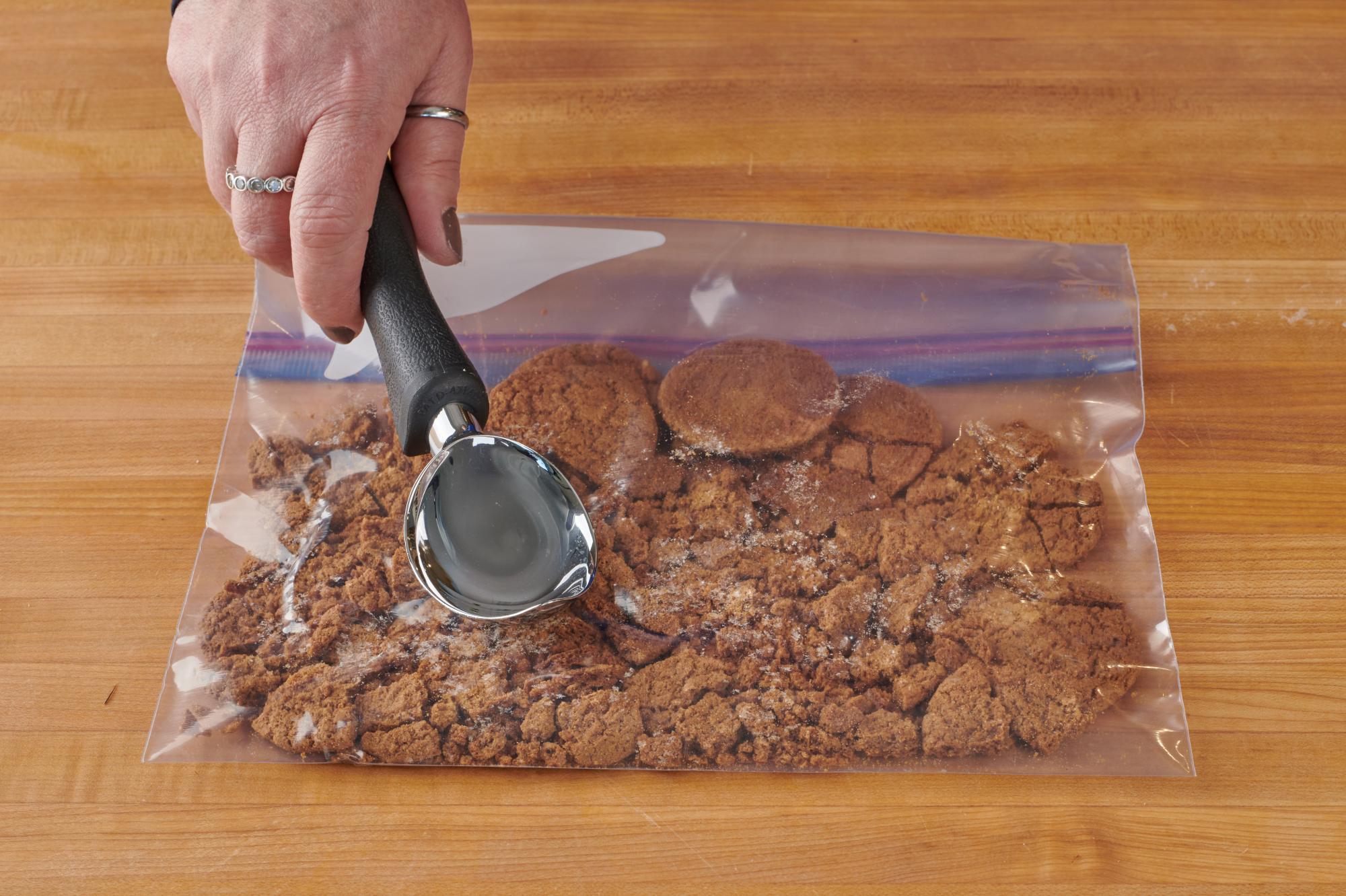 Smashing the gingersnaps with an Ice Cream Scoop.