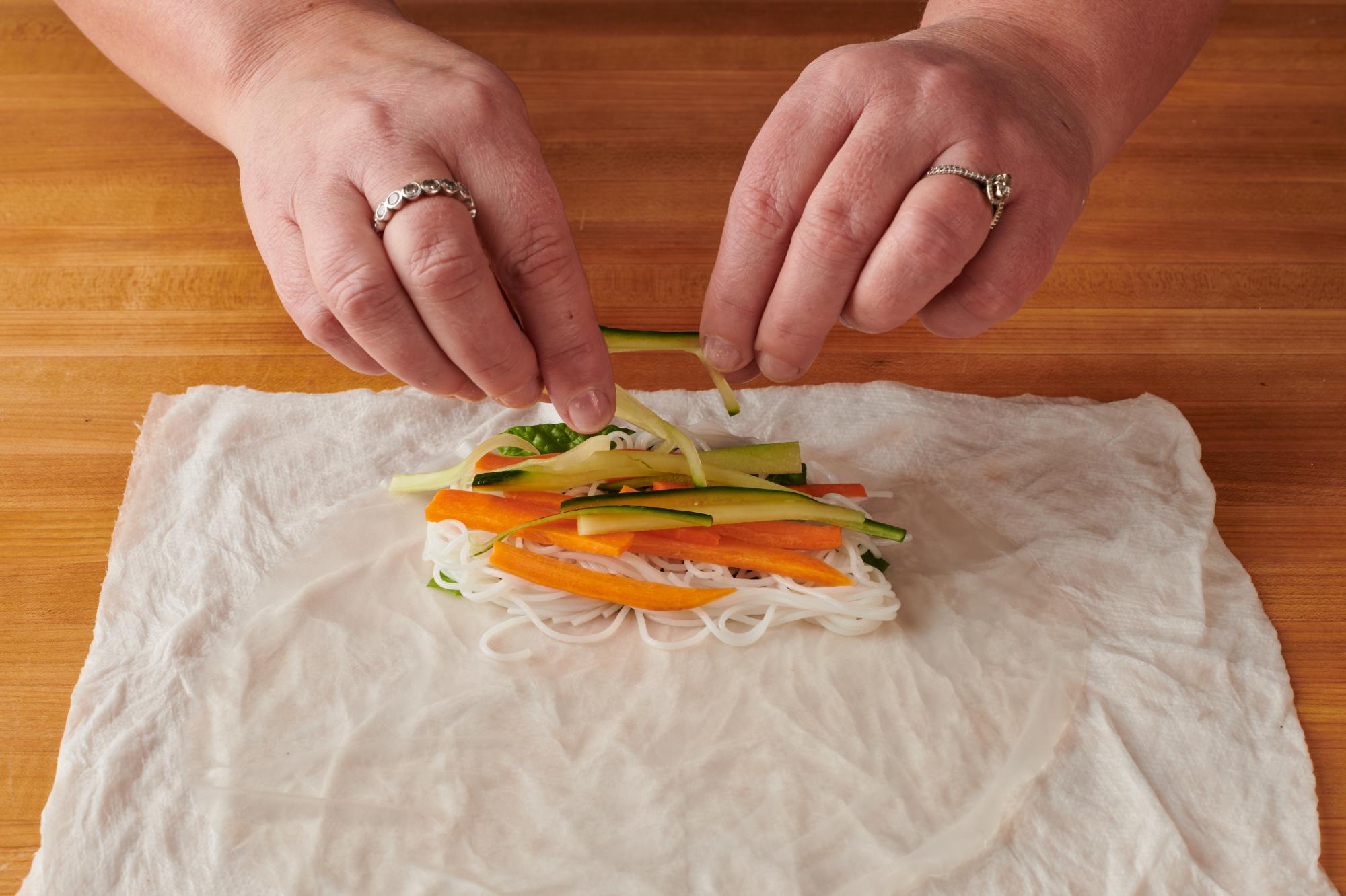 Laying ingredients in the rice paper.