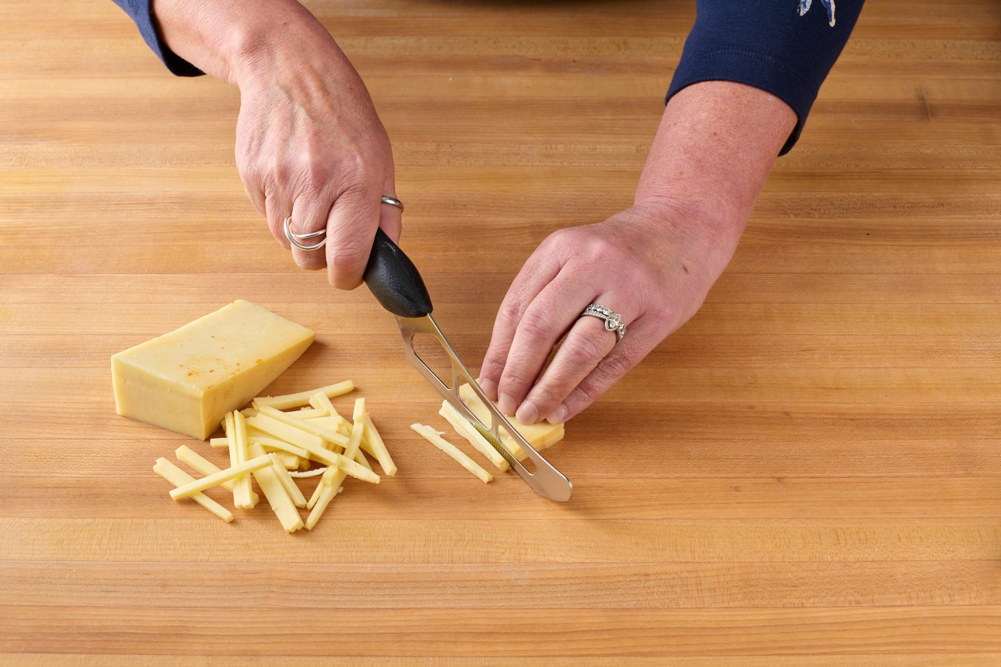 thinly slicing cheese 