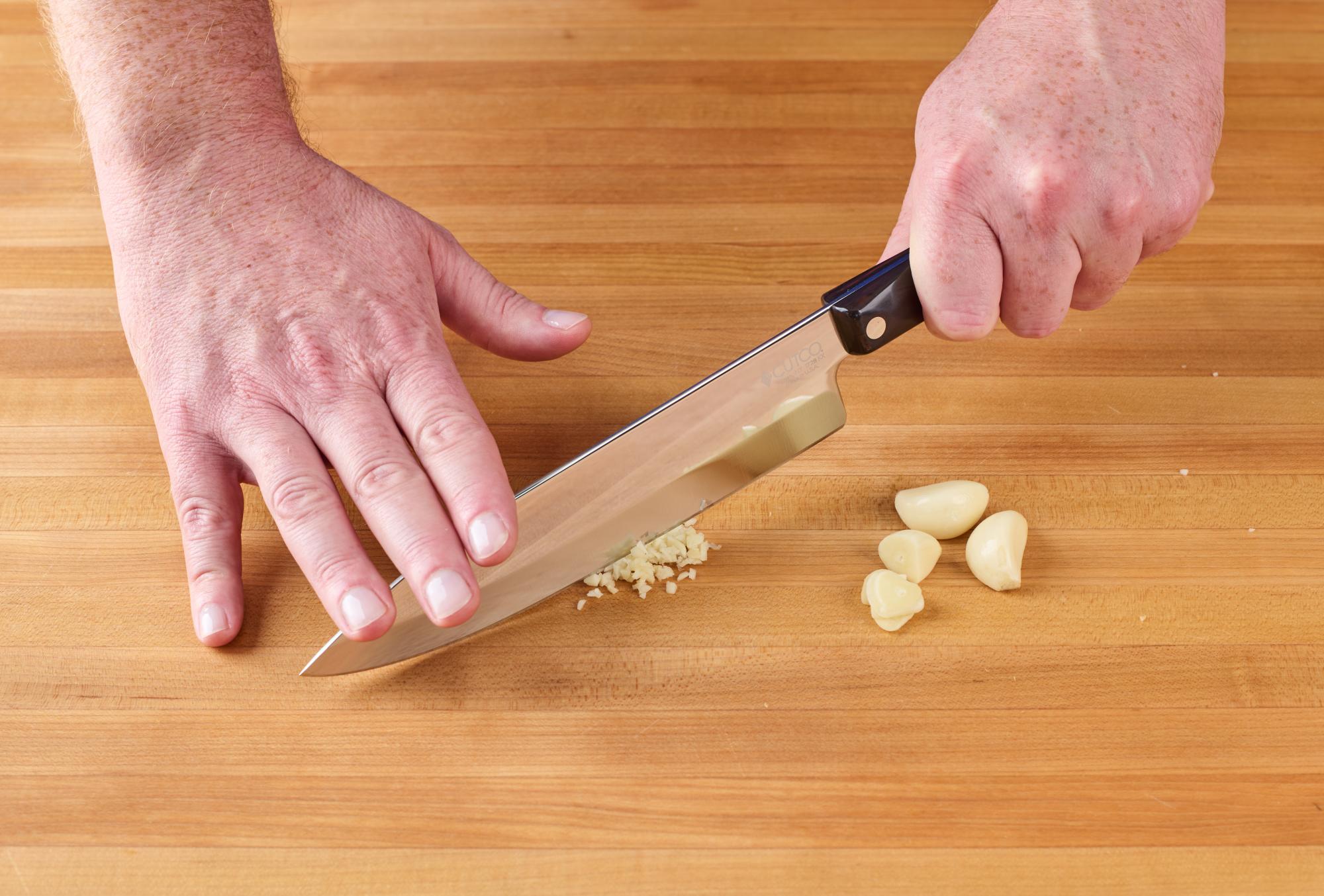 Mincing garlic with a Petite Chef.