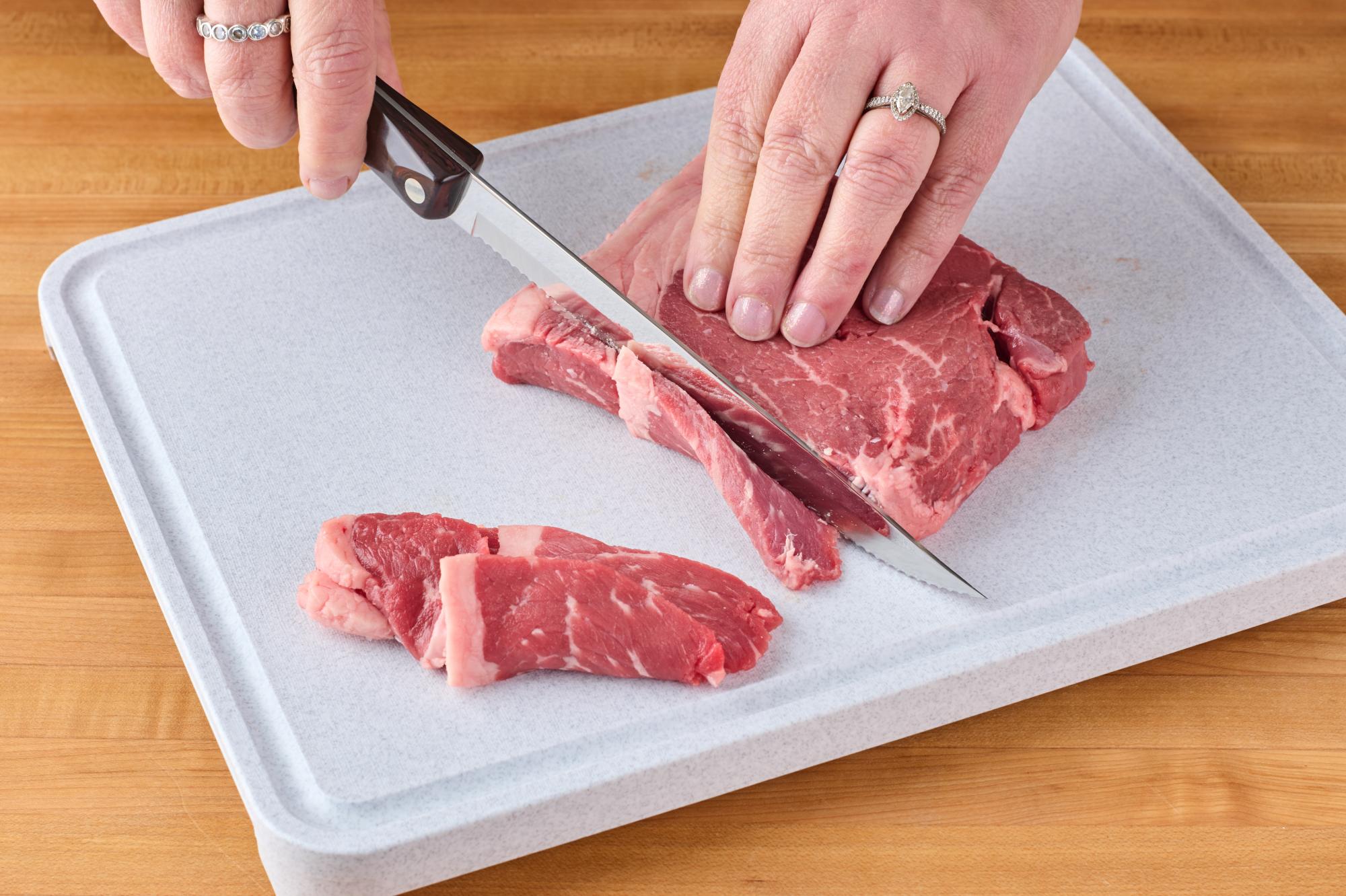 slicing steak with P Carver