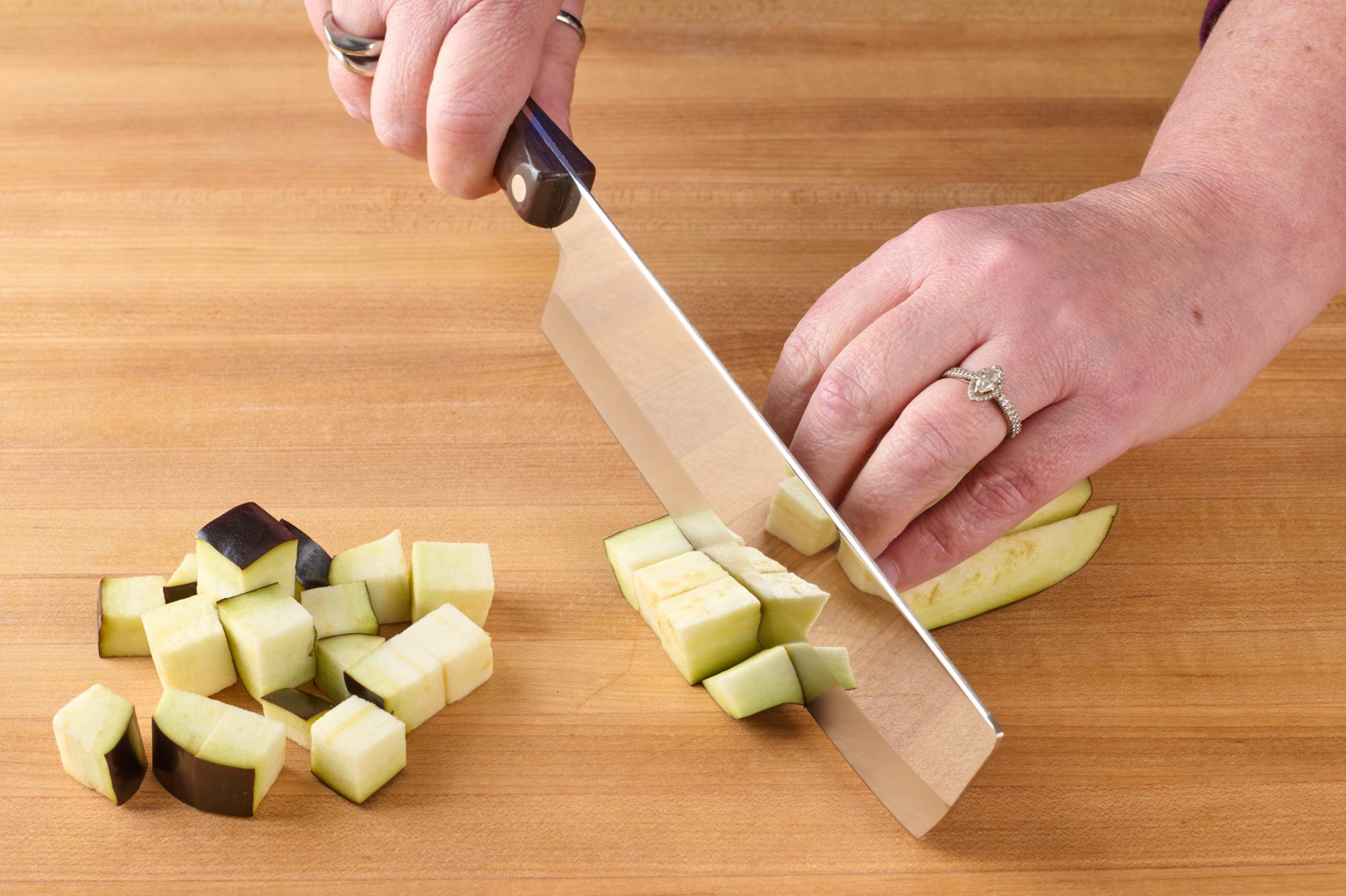 Cutting eggplant with Vegetable Knife.