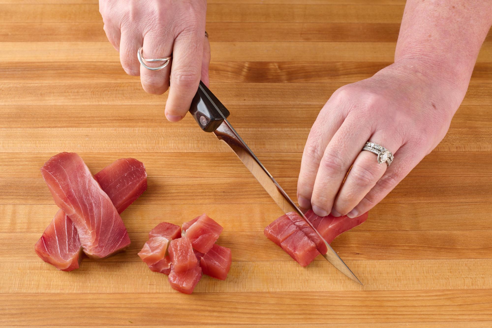 Dicing tuna with a Boning Knife.