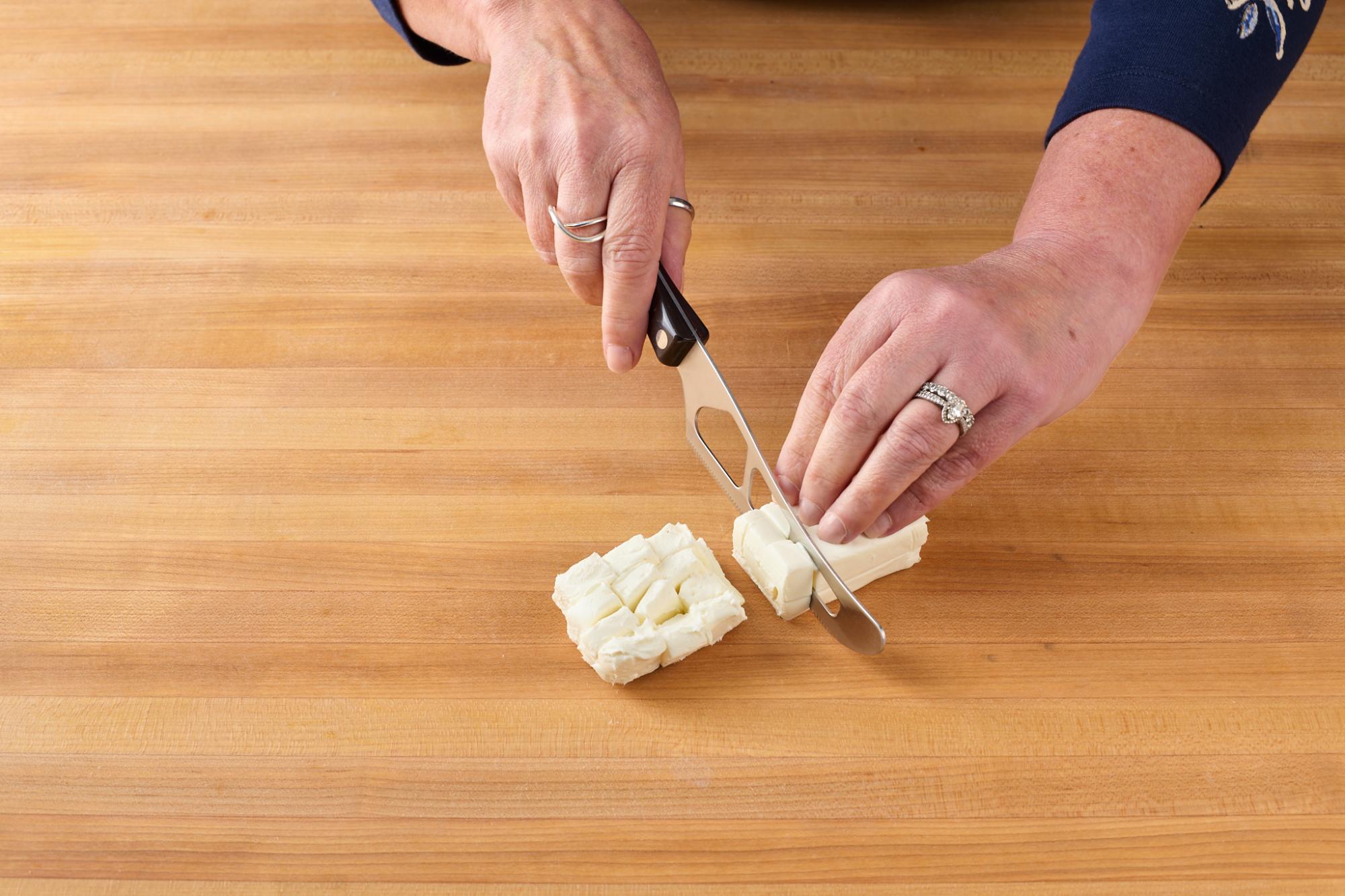 Cutting Neufchatel with Traditional Cheese Knife