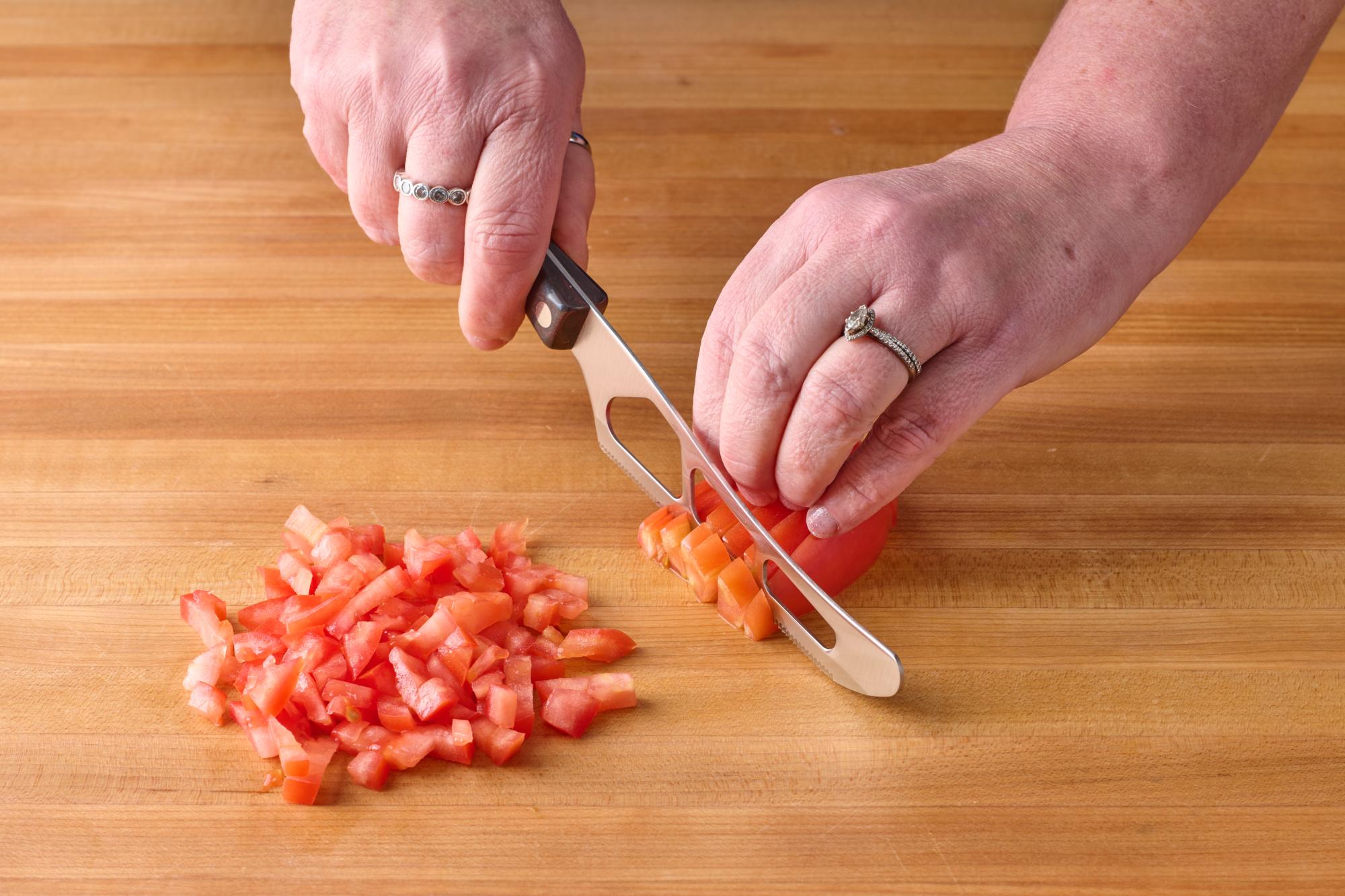 Dice the Roma tomatoes with a Traditional Cheese Knife.