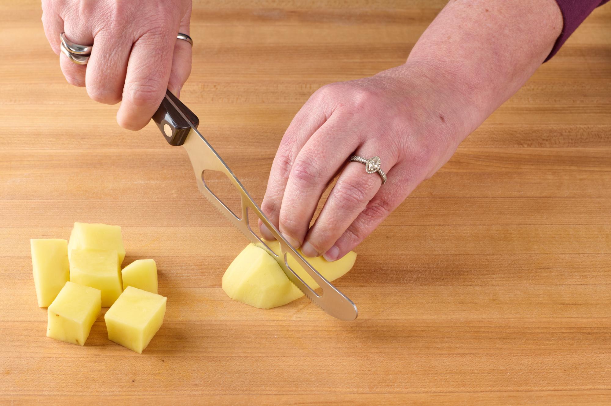 Cubing potatoes with Tradtional Cheese Knife.