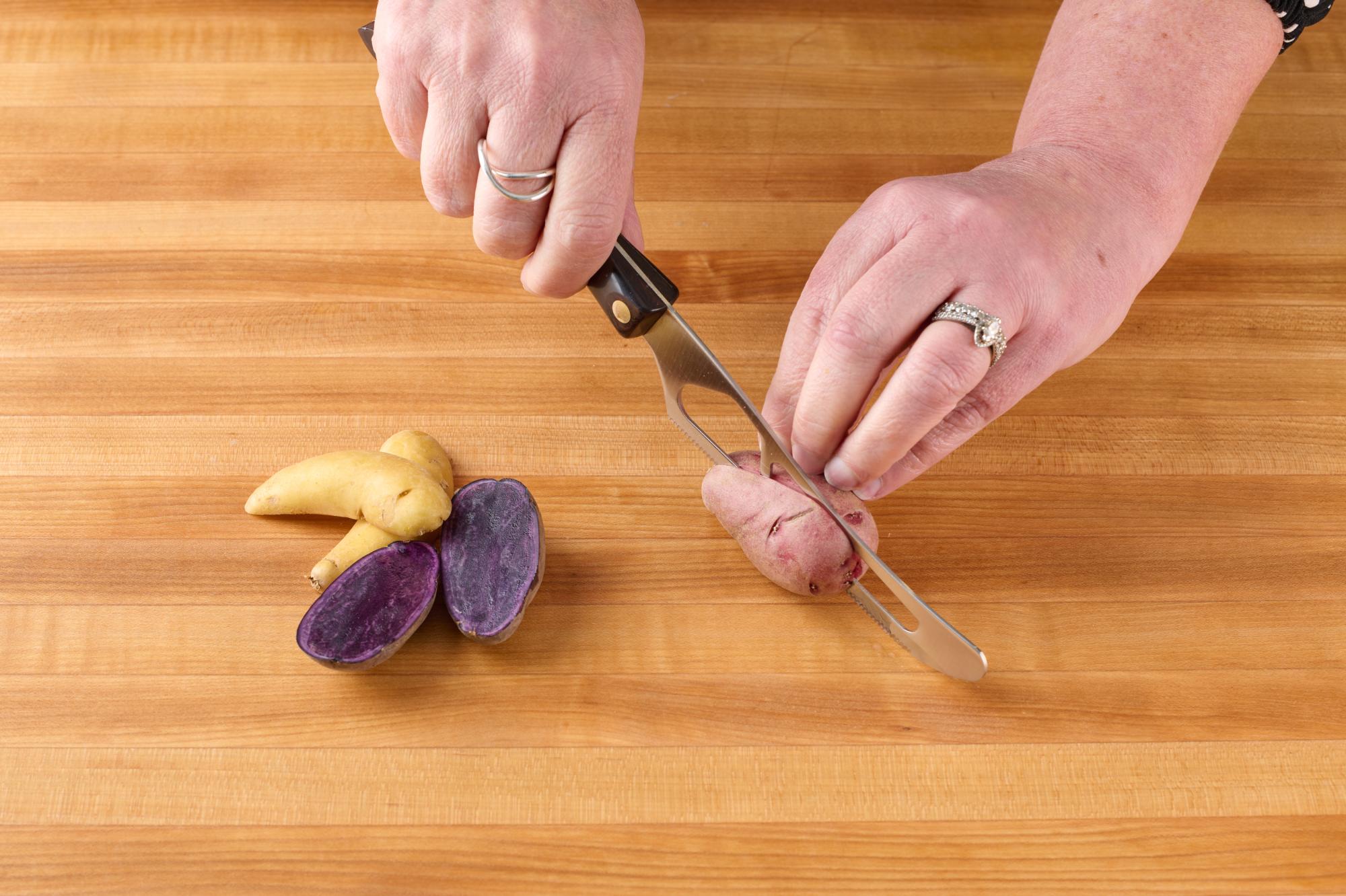 Cutting fingerlings with Traditional Cheese Knife.