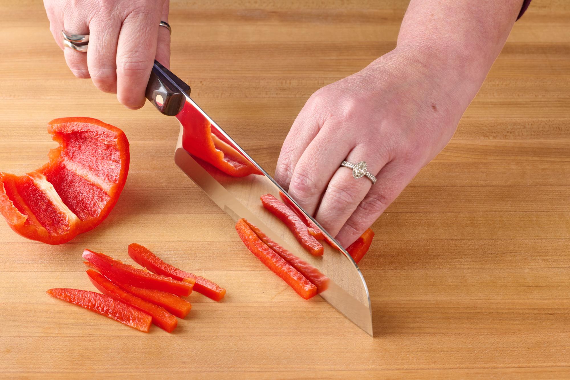 Cutting pepper with Petite Santoku.