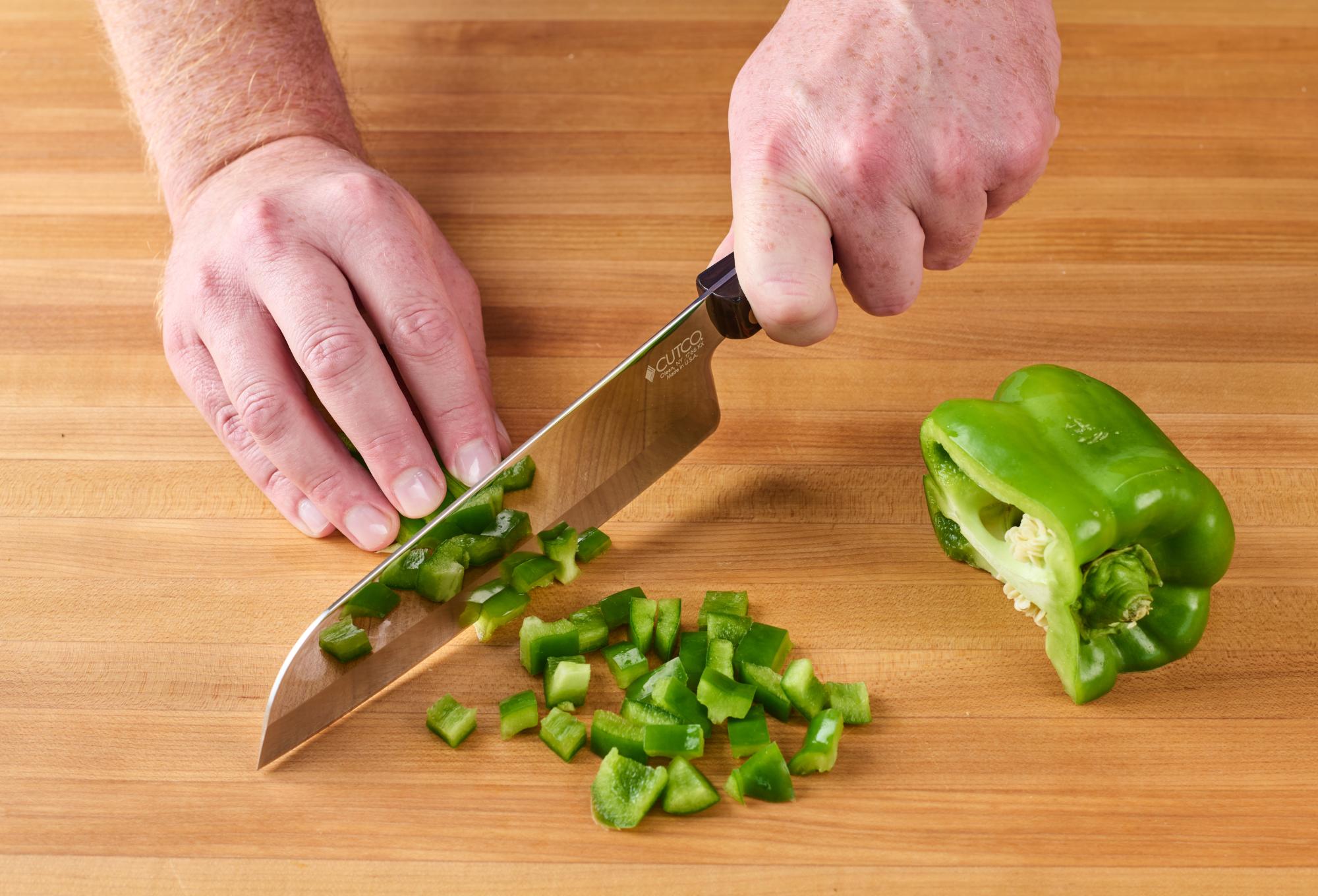 Chopping bell pepper with a 7 inch Santoku.