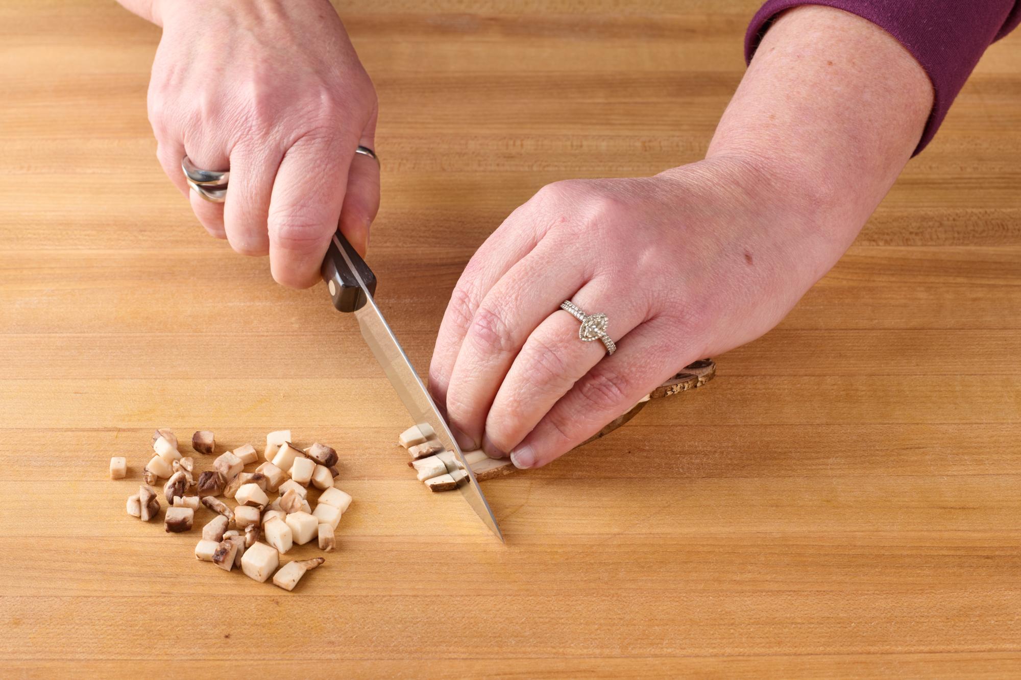 Cutting mushroom with 4″ Paring Knife.