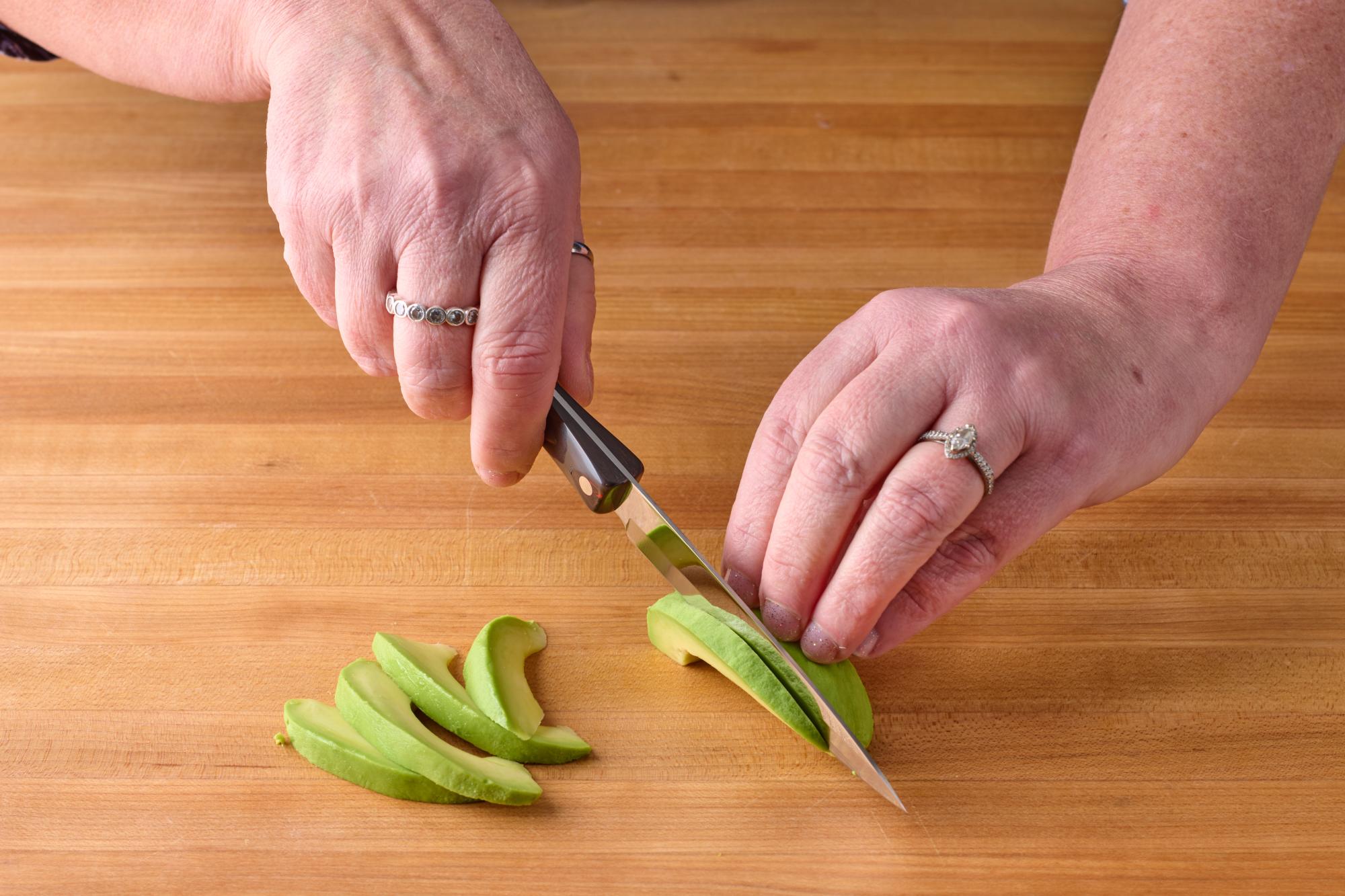 Slicing avocado with a 4 Inch Paring knife.