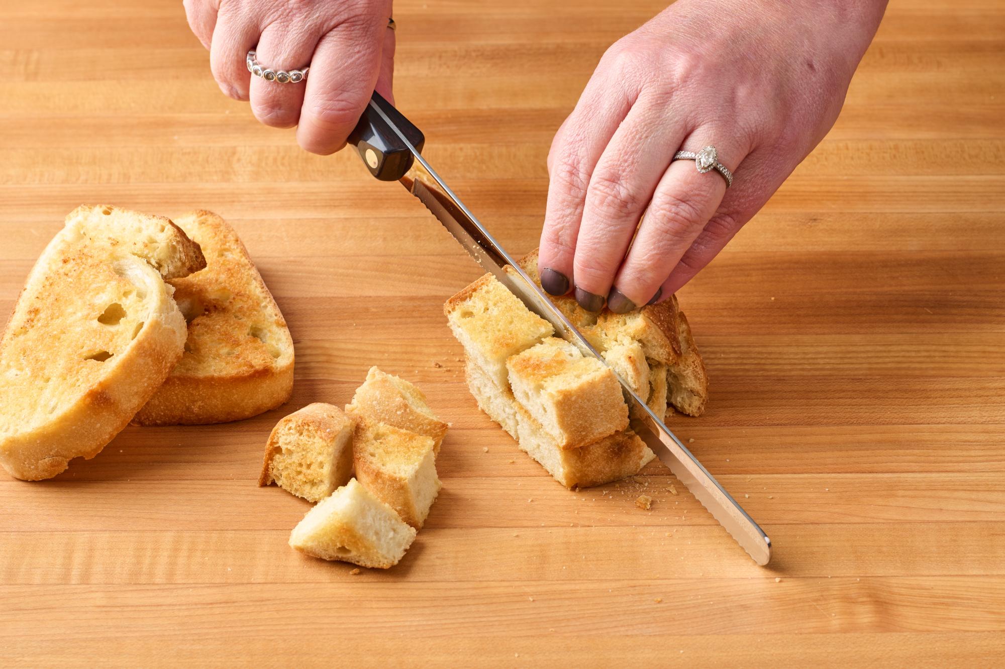 slicing toasted bread into cubes with a P Slicer