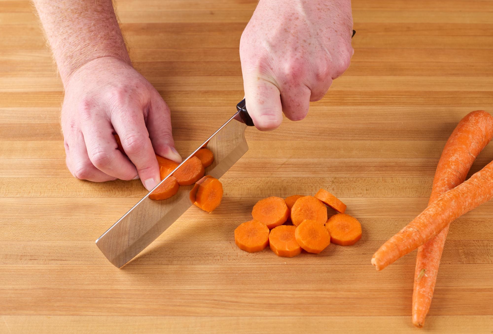 Slicing the carrots with a 6 Inch Vegetable Knife.