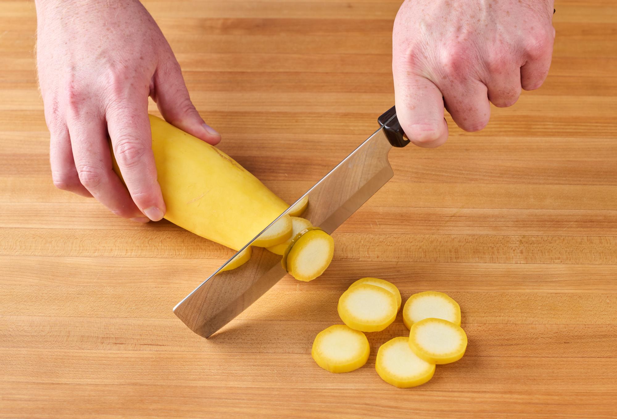 Slicing squash with a 6" Vegetable Knife.