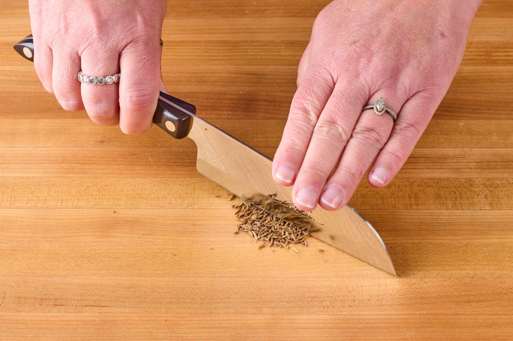 Finely chop the caraway seeds with a Petite Santoku.