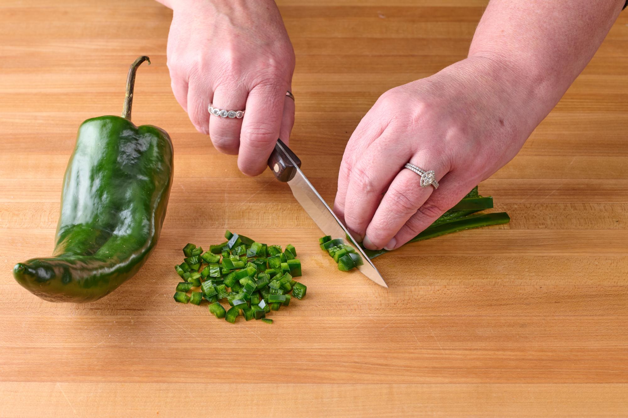 Use a 4 Inch Gourmet Paring Knife to chop the poblano pepper.