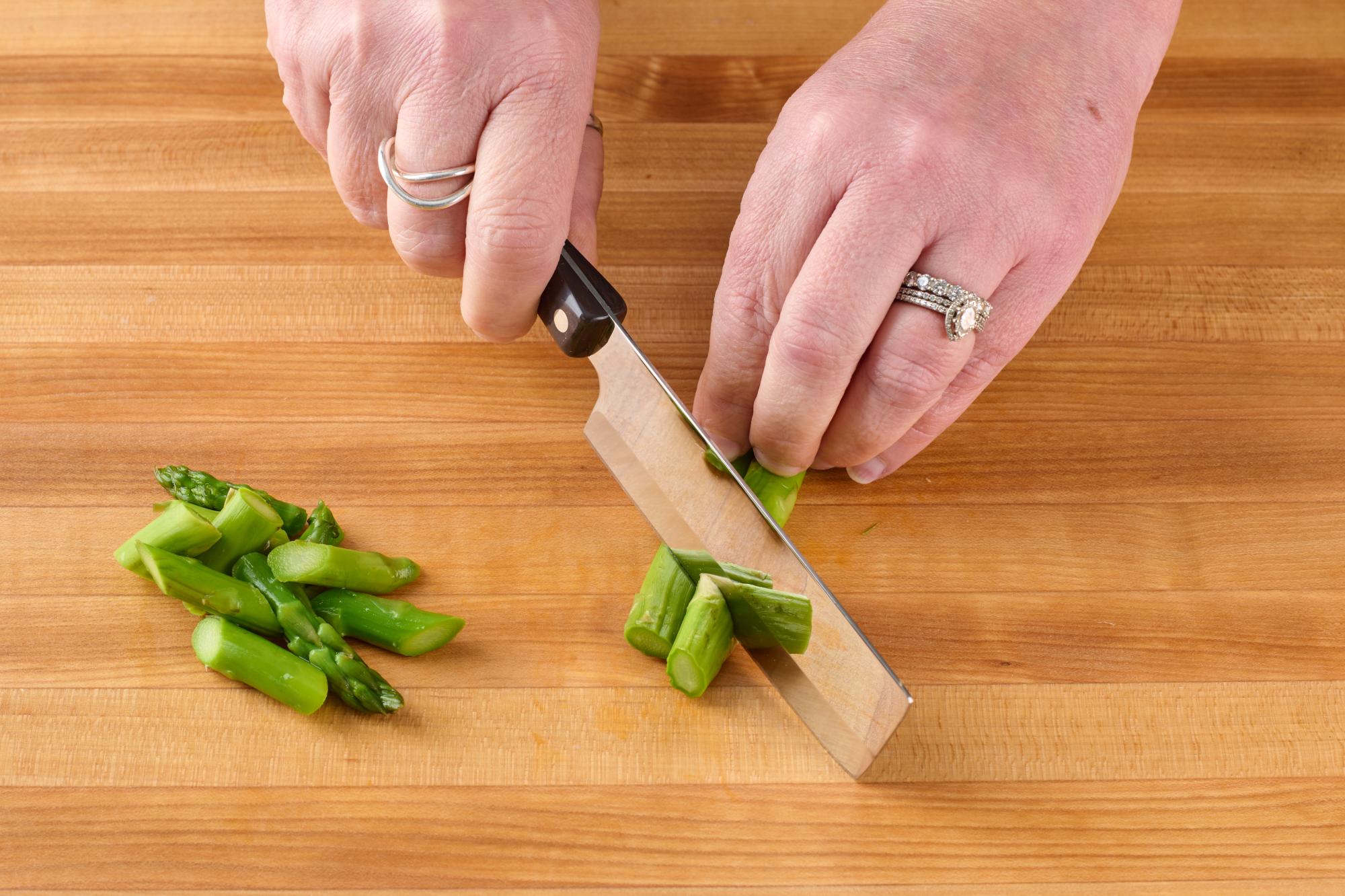 Use a 4 Inch Vegetable Knife to slice asparagus on the bias.
