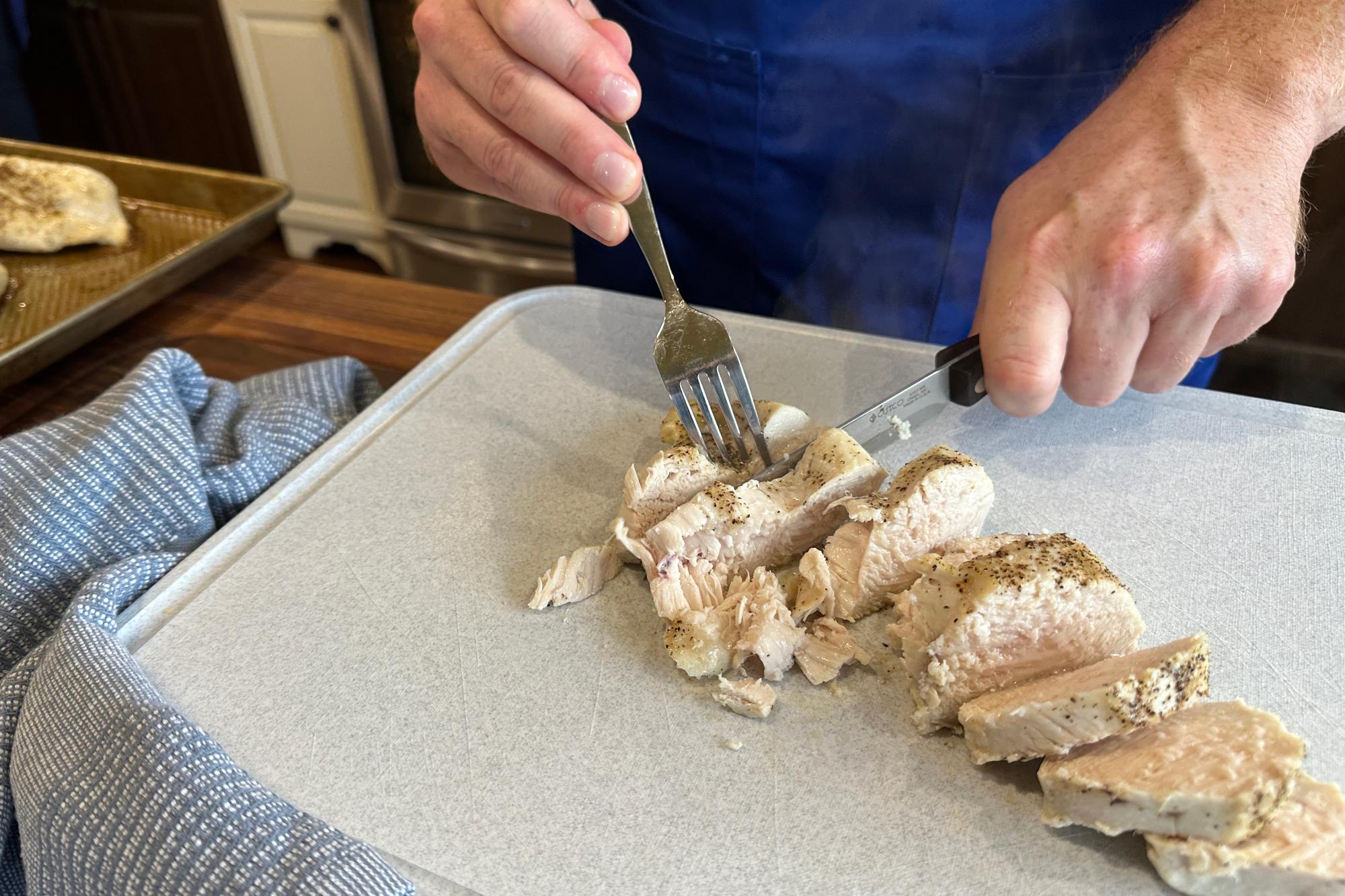 Slicing the chicken with a Santoku-Style Trimmer.