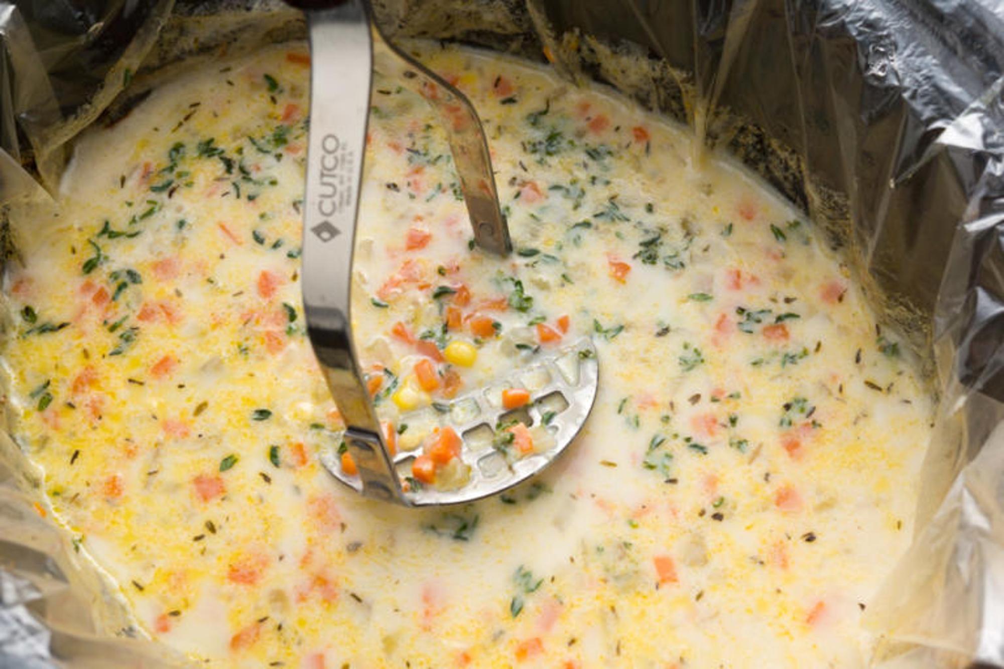 mashing potatoes in soup