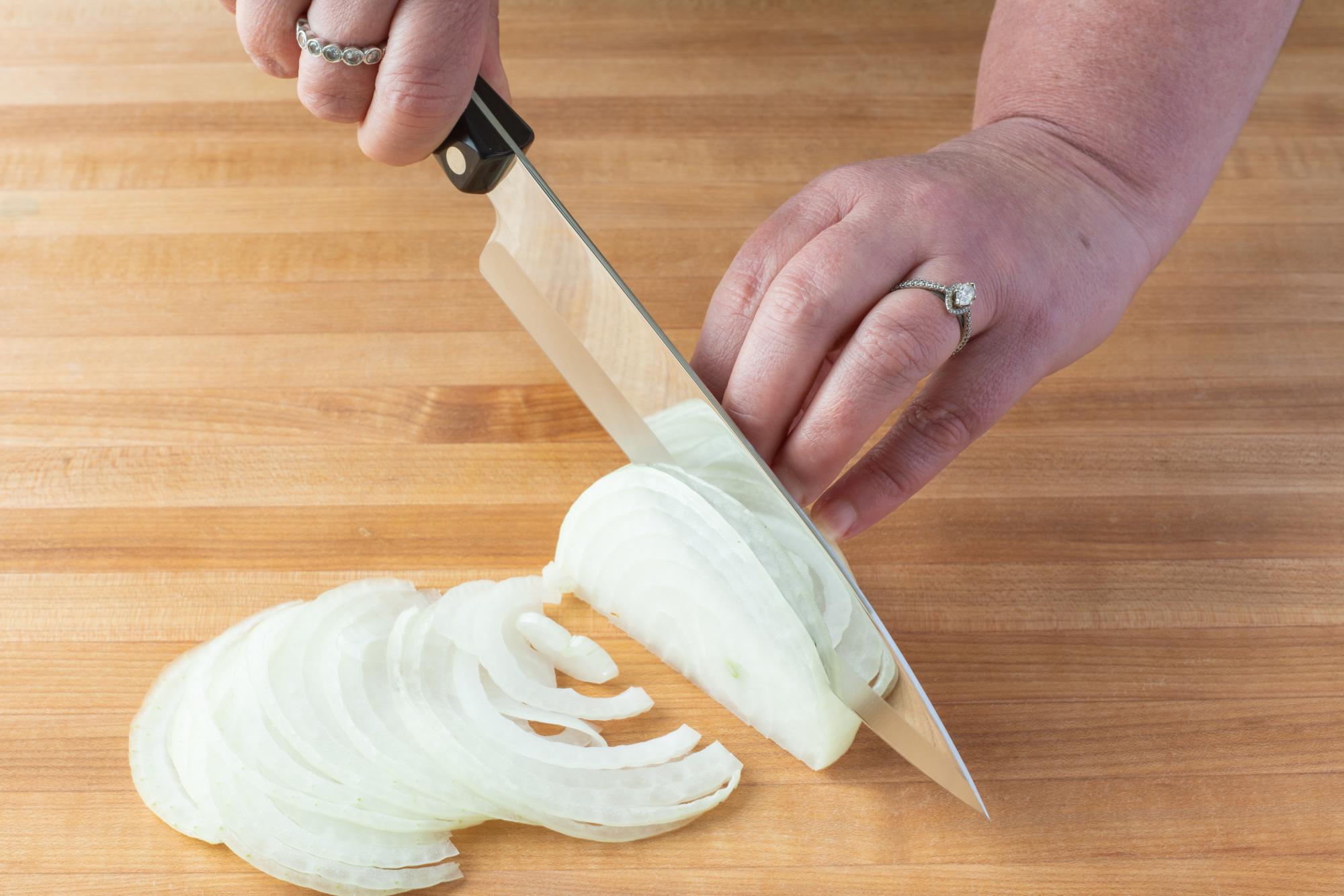 Slicing onion with a Petite Chef.