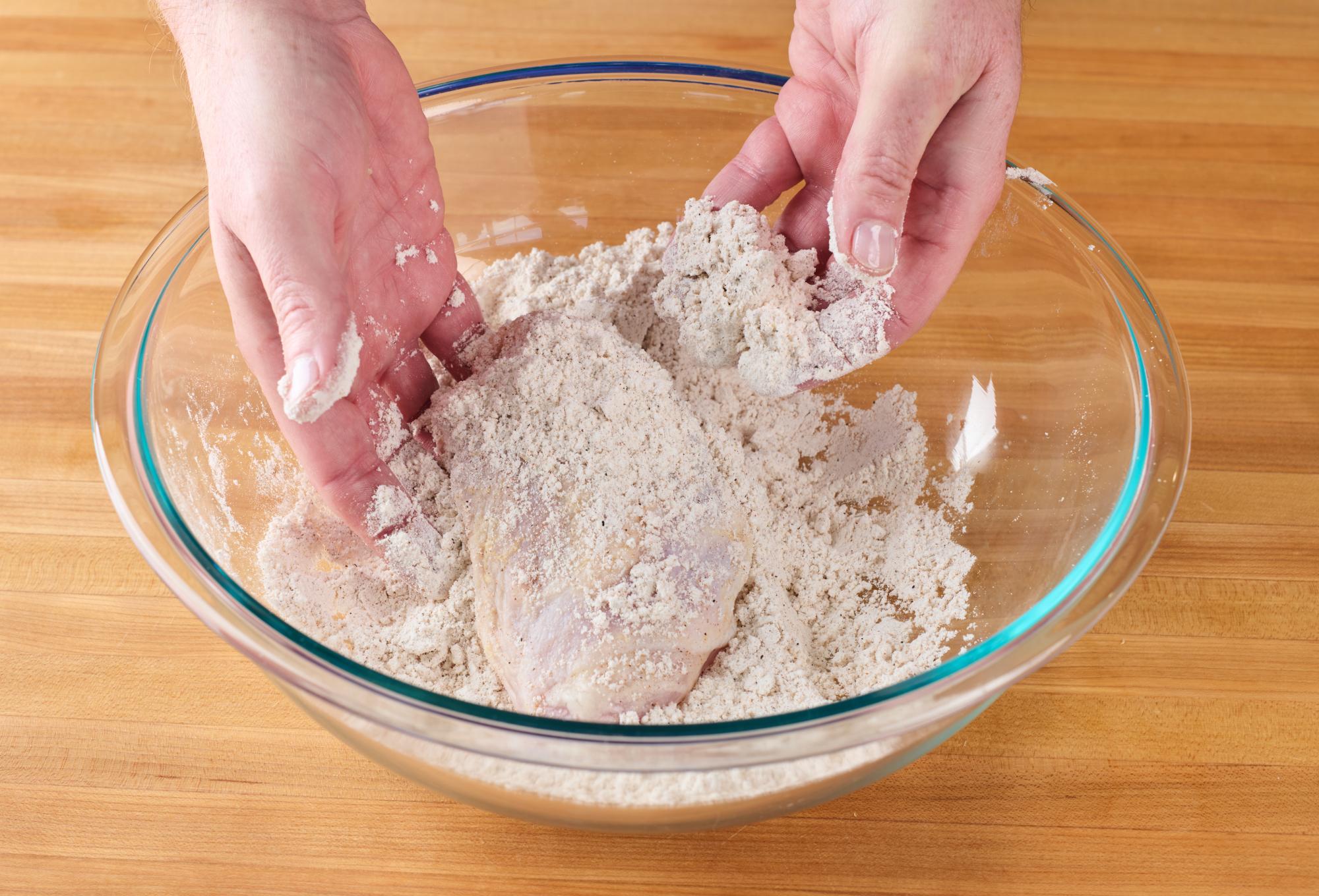 Coating chicken with dry mixture