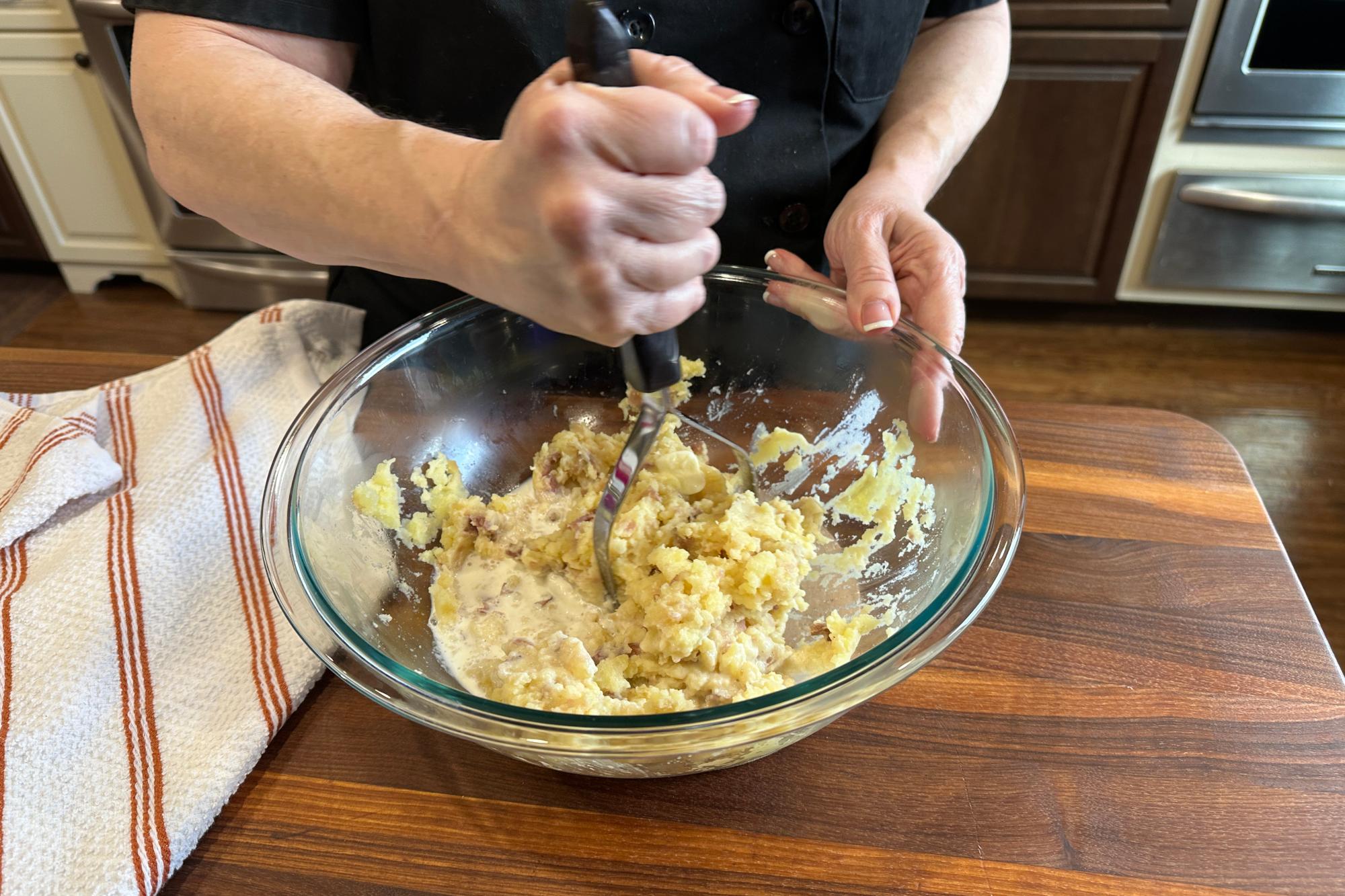Mashed potatoes with a Potato Masher.